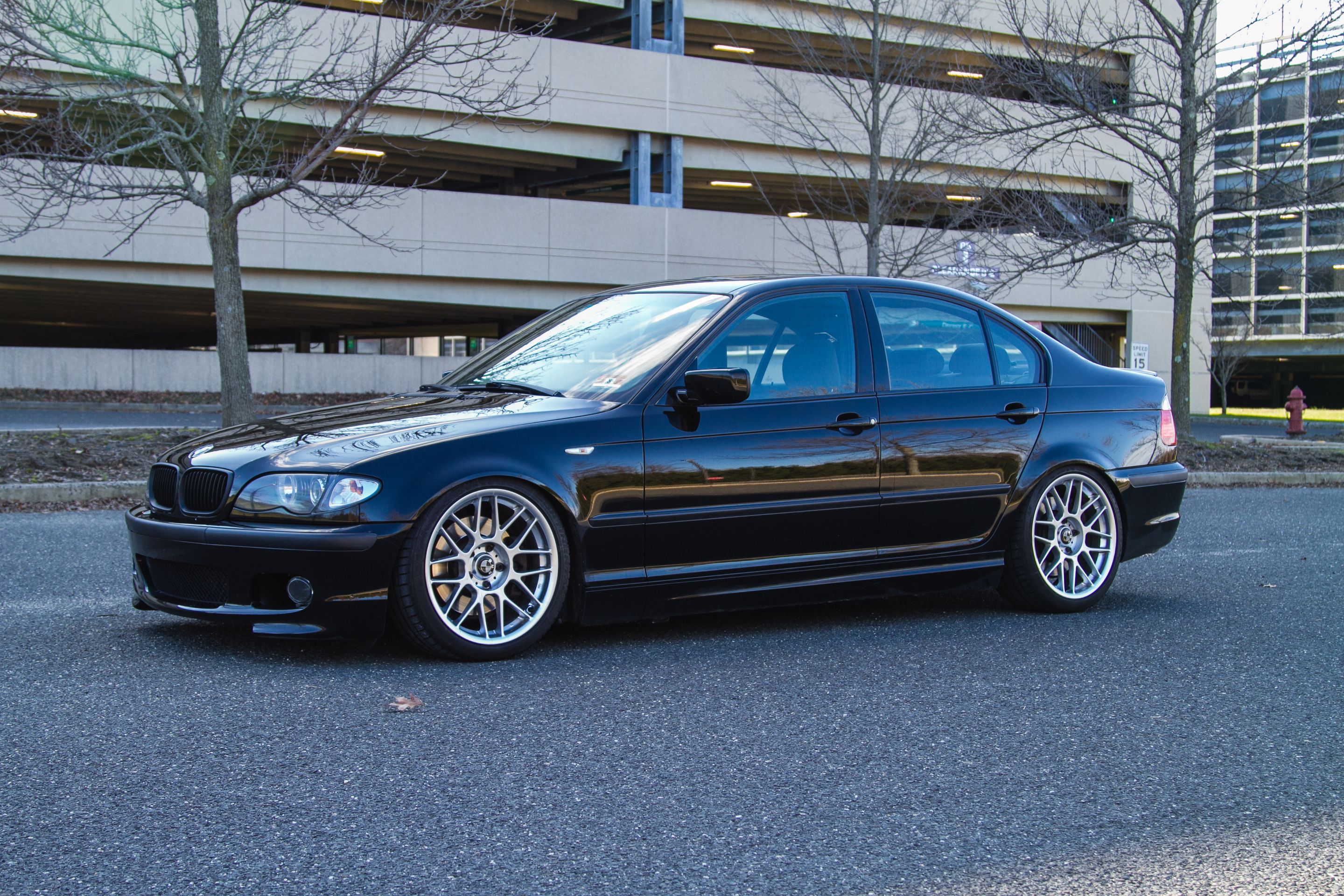 Black BMW E46 3 Series with 18" ARC-8 Apex wheels in Hyper Silver