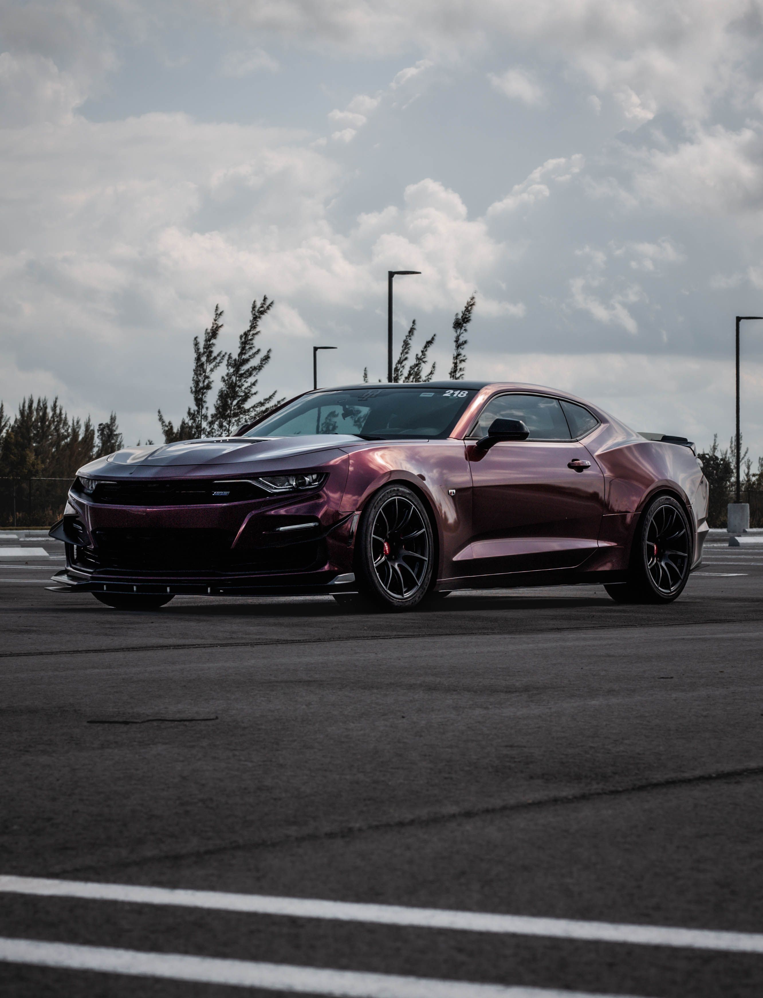 Red Chevrolet 6th Gen Camaro SS with 19" SM-10 Apex wheels in Satin Black