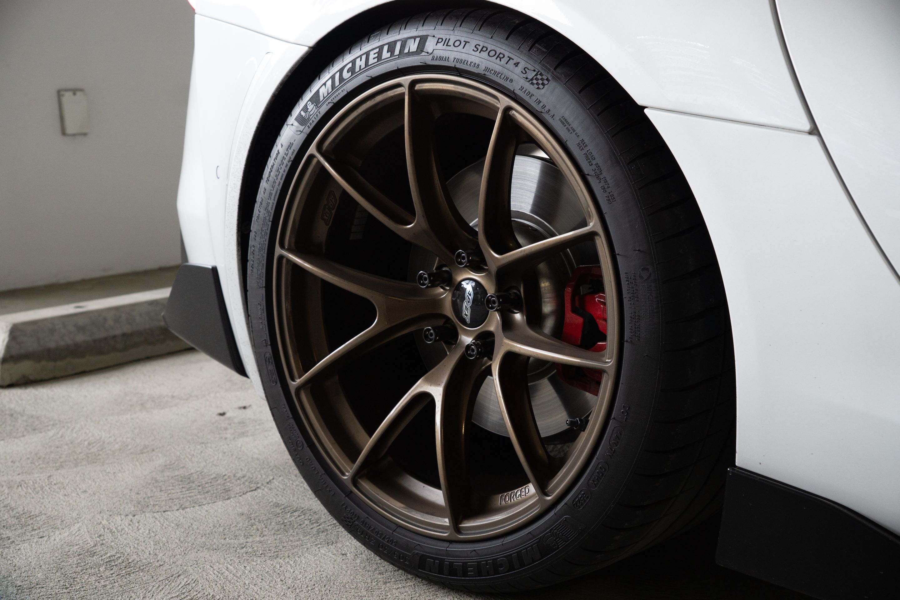White Toyota GR Supra with 19" VS-5RS Apex wheels in Satin Bronze