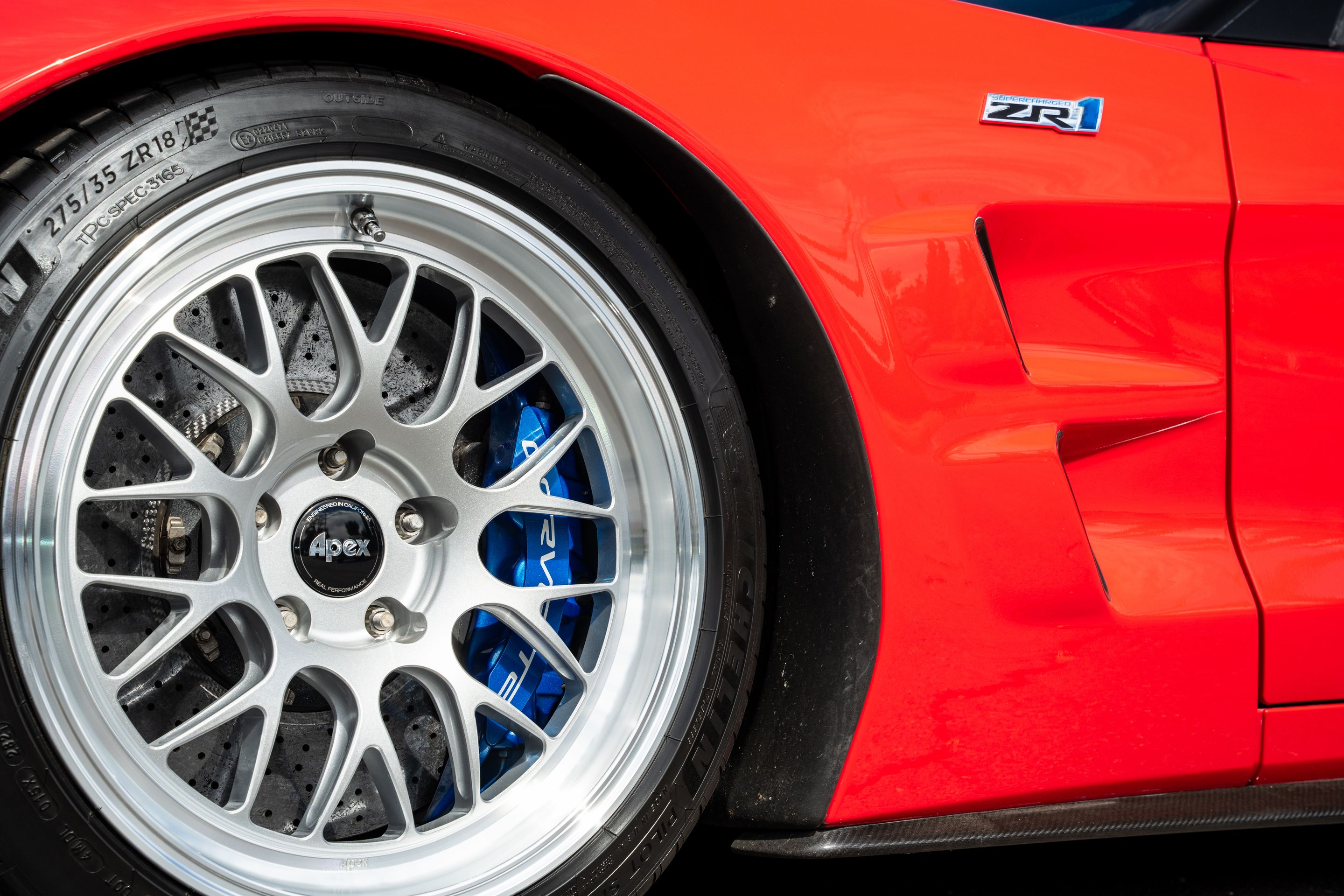 Red Chevrolet C6 Corvette ZR-1 with 18"/19" ML-10RT Apex wheels in Machined Lip Race Silver