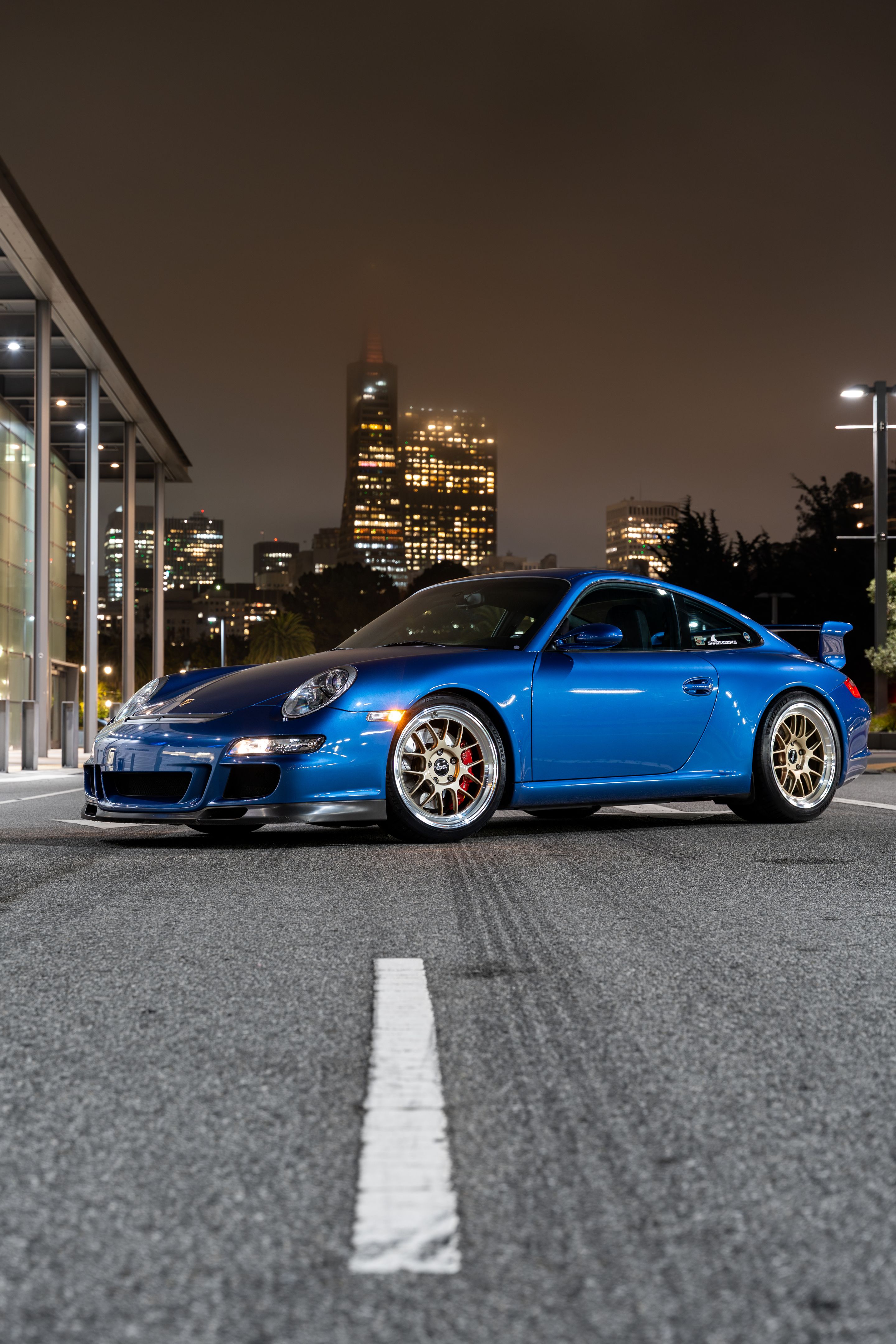 Blue Porsche 911 997 GT3 with 19" TEST-M Apex wheels in Machined Lip Gloss Motorsport Gold
