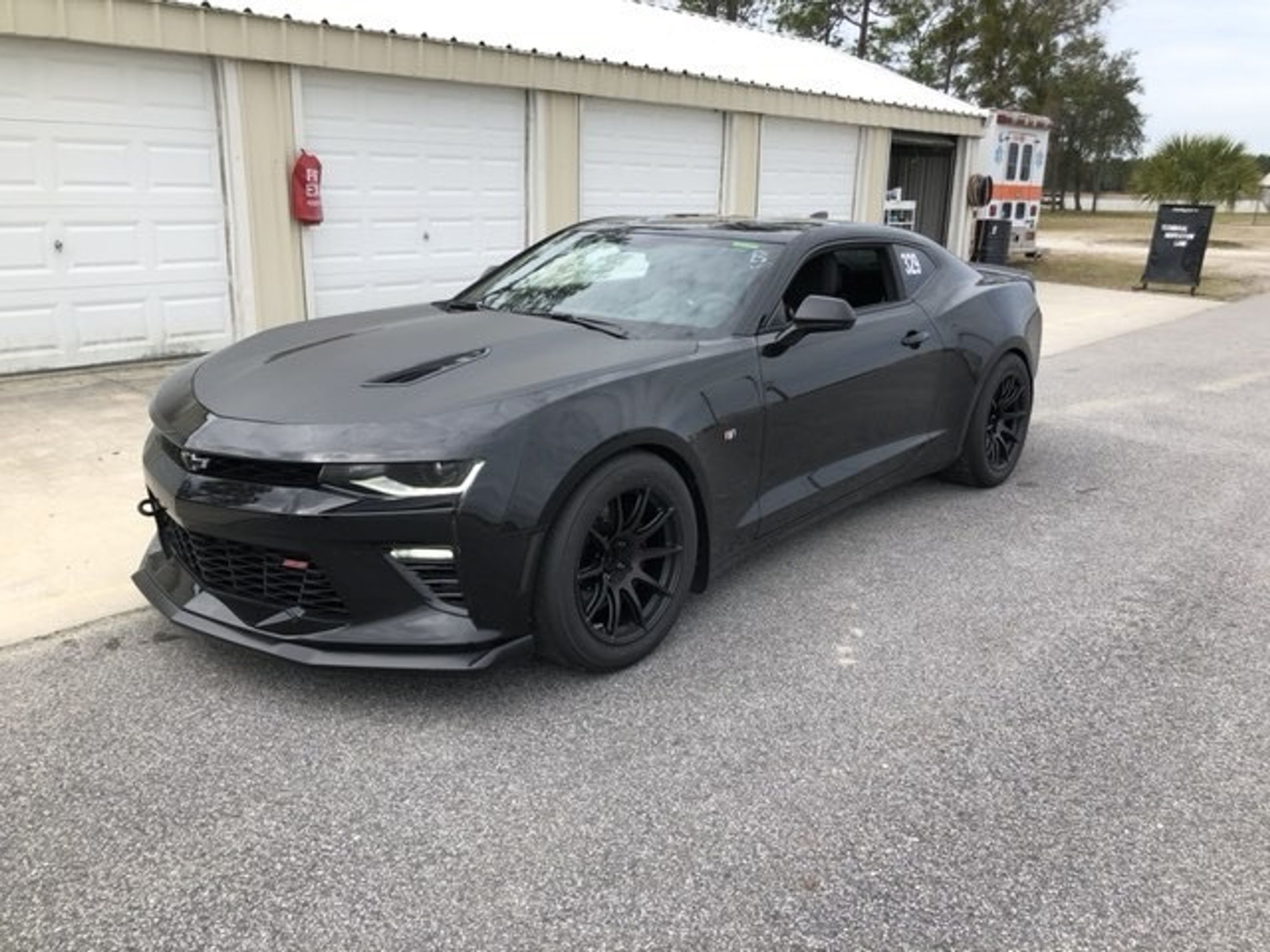 Black Chevrolet 6th Gen Camaro SS 1LE with 18" SM-10 Apex wheels in Satin Black