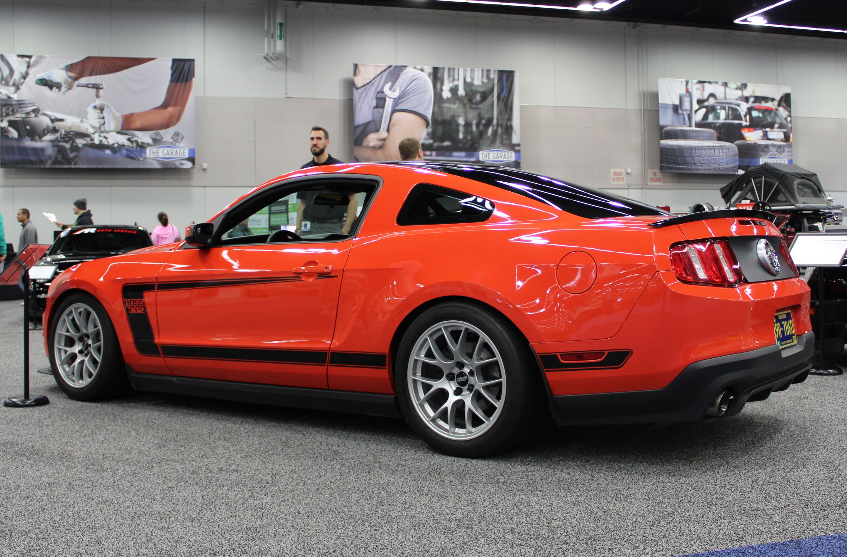 Orange Ford S197 Mustang Boss 302 with 18" EC-7 Apex wheels in Race Silver