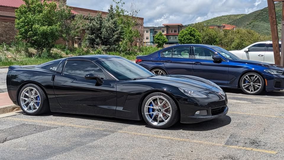 Black Chevrolet C6 Corvette Base/Z51 with 18" VS-5RS Apex wheels in Brushed Clear