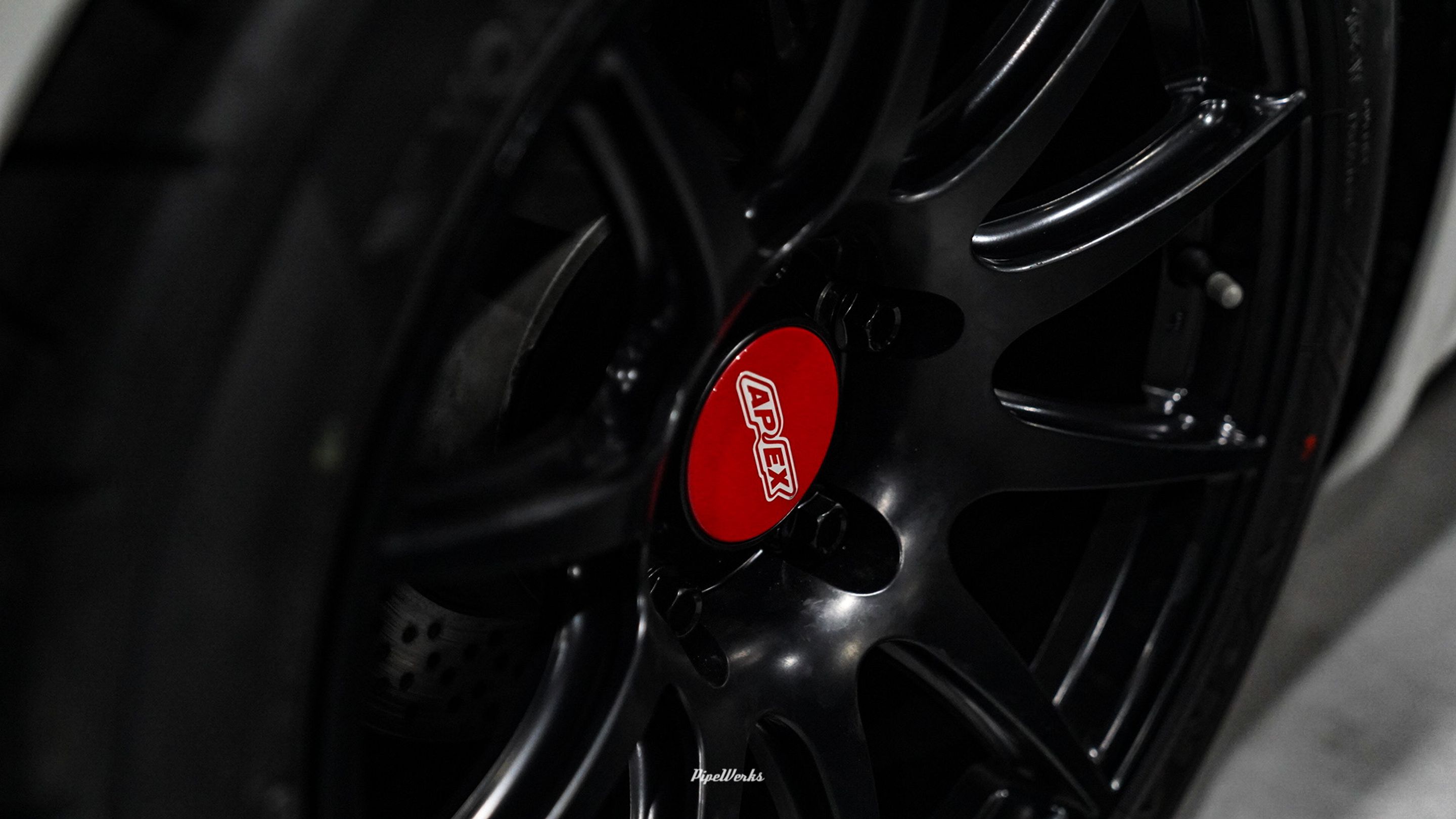 White Porsche 718 Cayman Base with 18" SM-10 Apex wheels in Satin Black