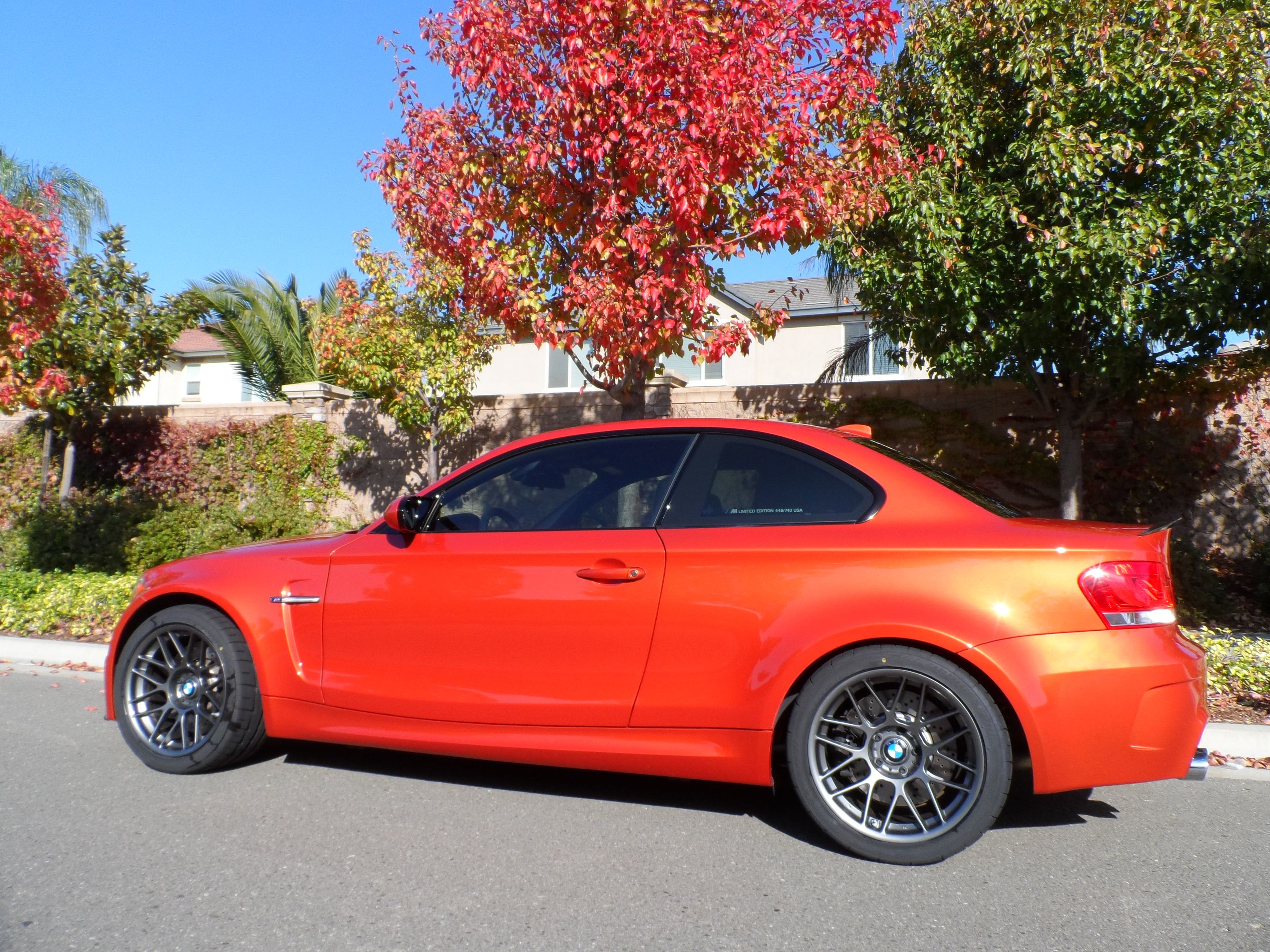 Orange BMW E82 1M with 18" ARC-8 Apex wheels in Satin Black