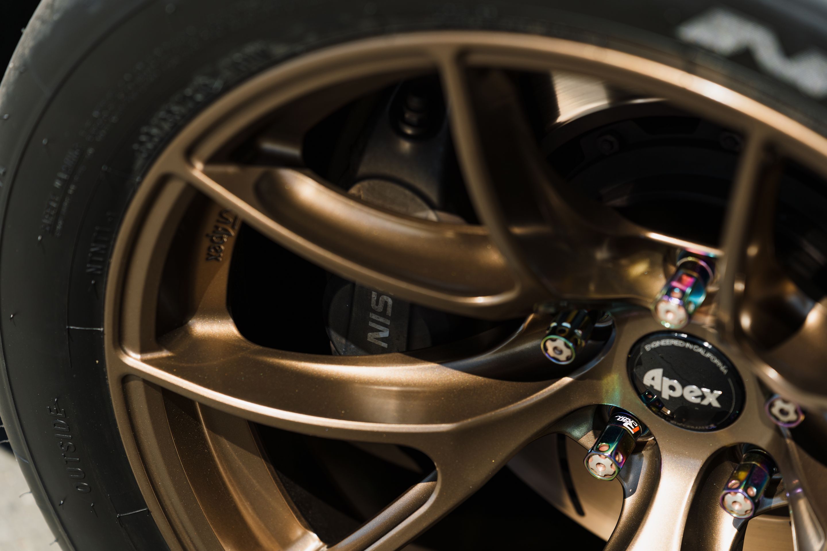 Black Nissan 370Z with 18" VS-5RS Apex wheels in Satin Bronze