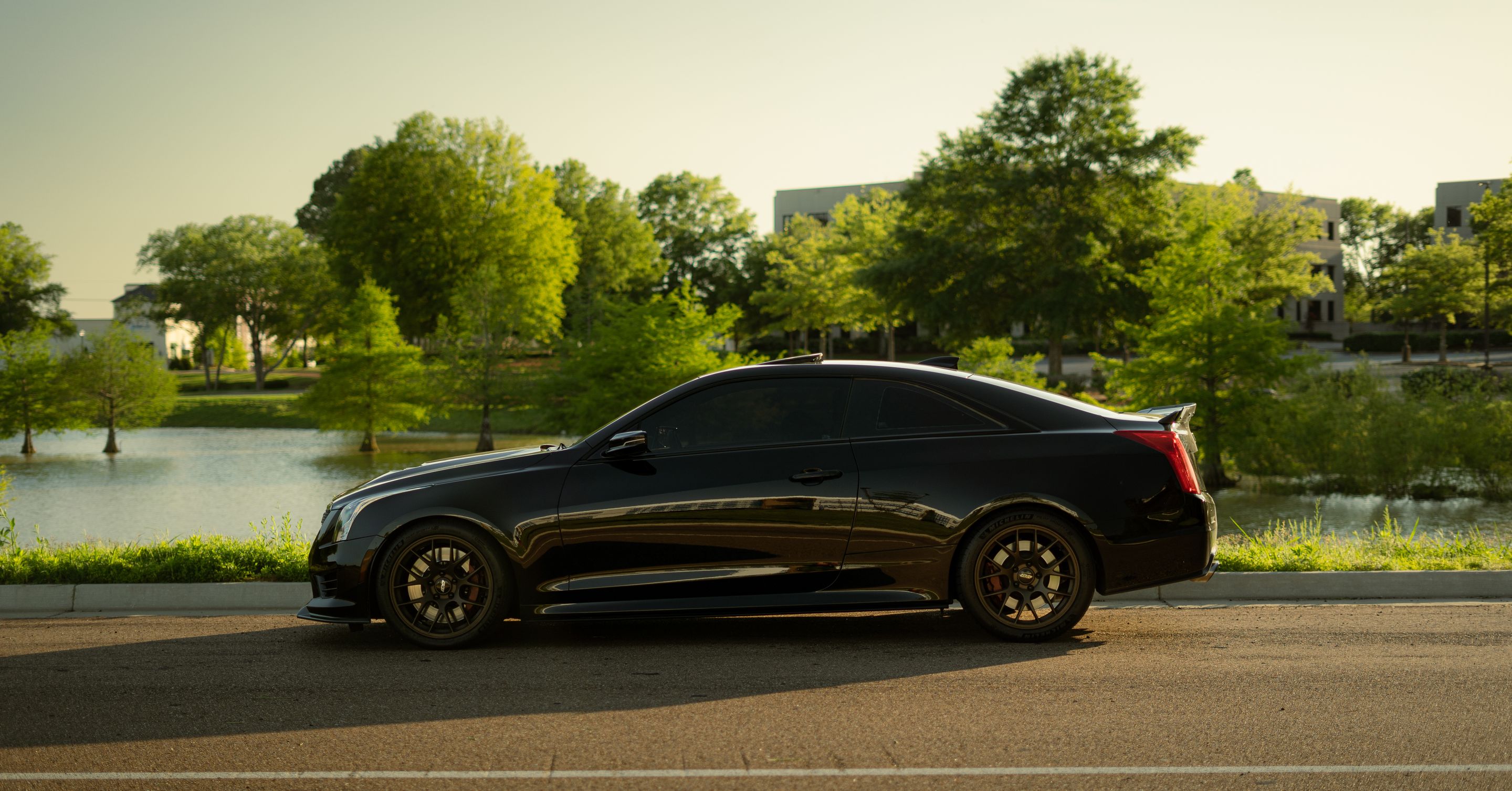 Black Cadillac ATS-V with 18" EC-7 Apex wheels in Satin Bronze