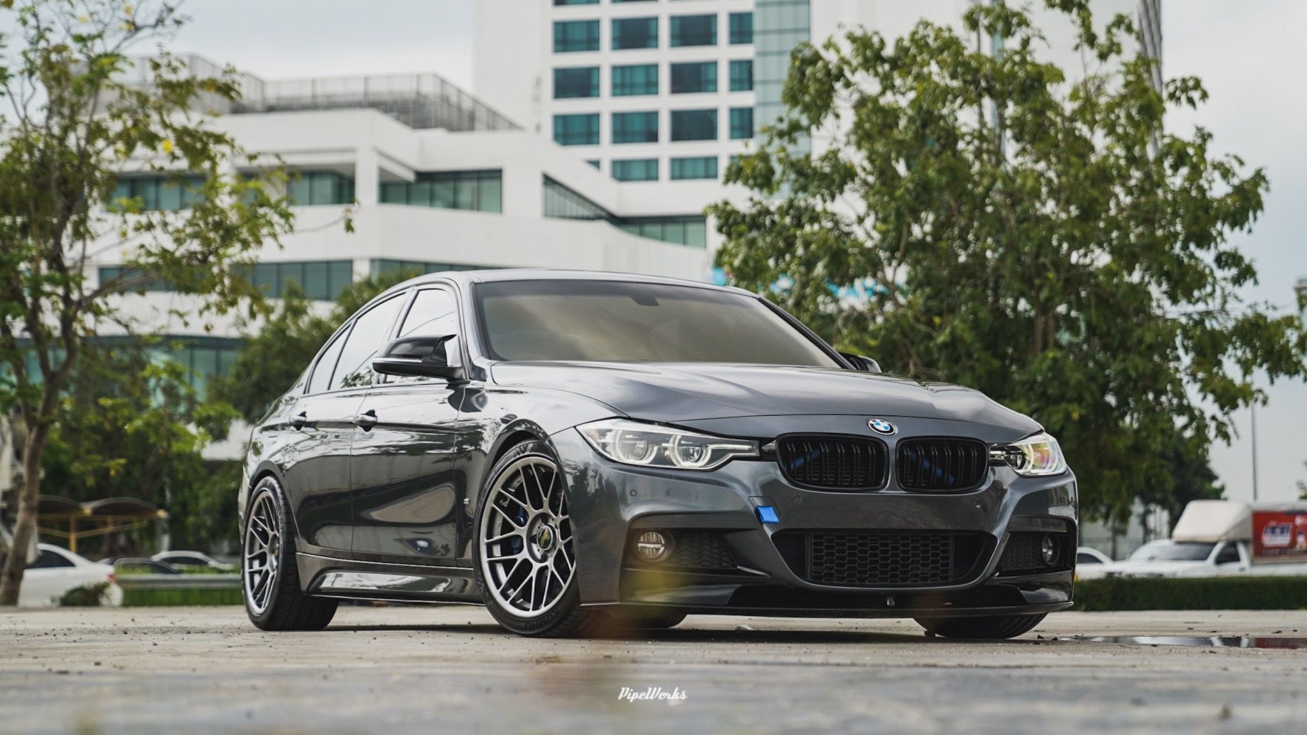 Grey BMW F30 Sedan 3 Series with 18" ARC-8 Apex wheels in Hyper Black