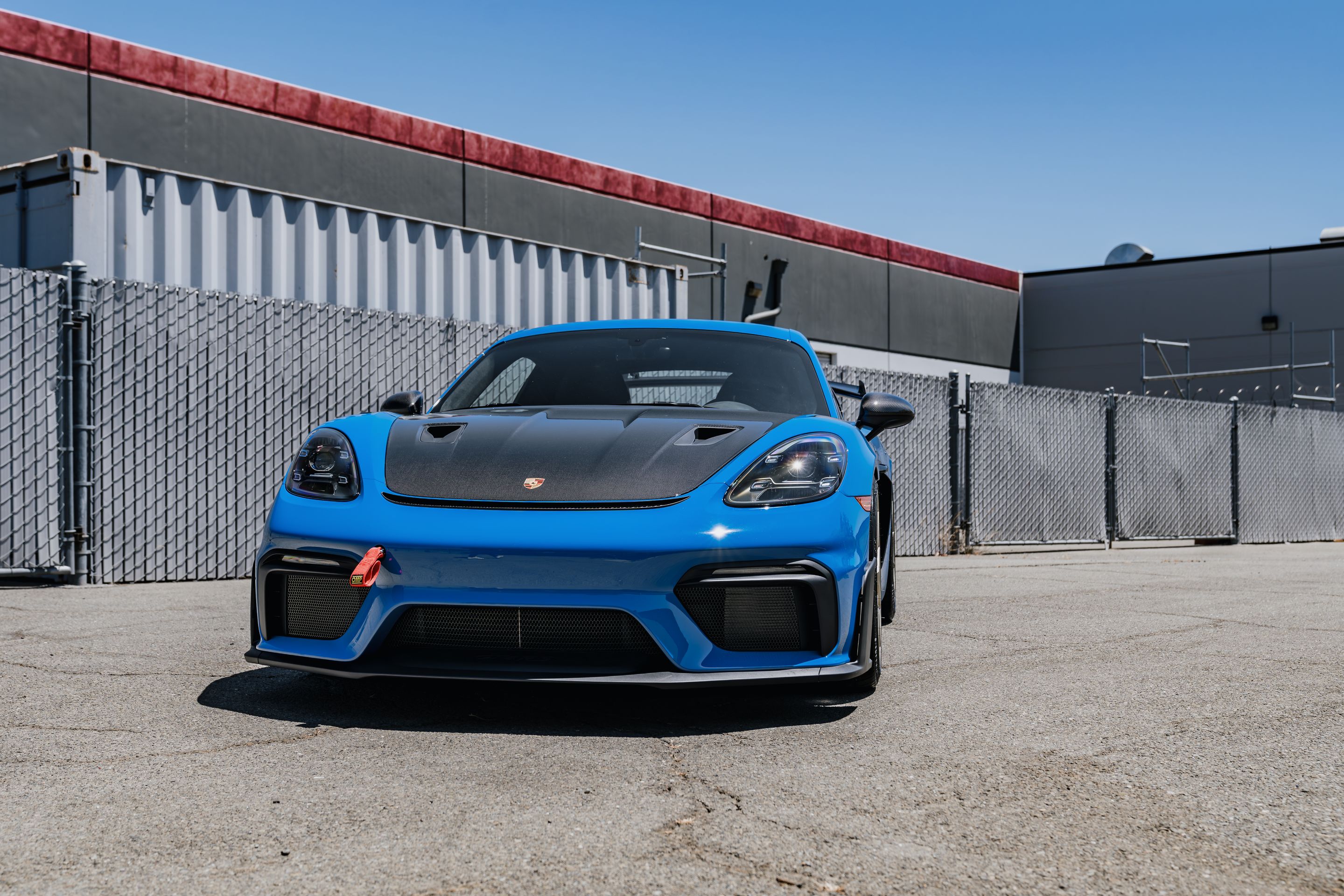 Blue Porsche 718 Cayman GT4 RS with 20" VS-5RS Apex wheels in Motorsport Gold