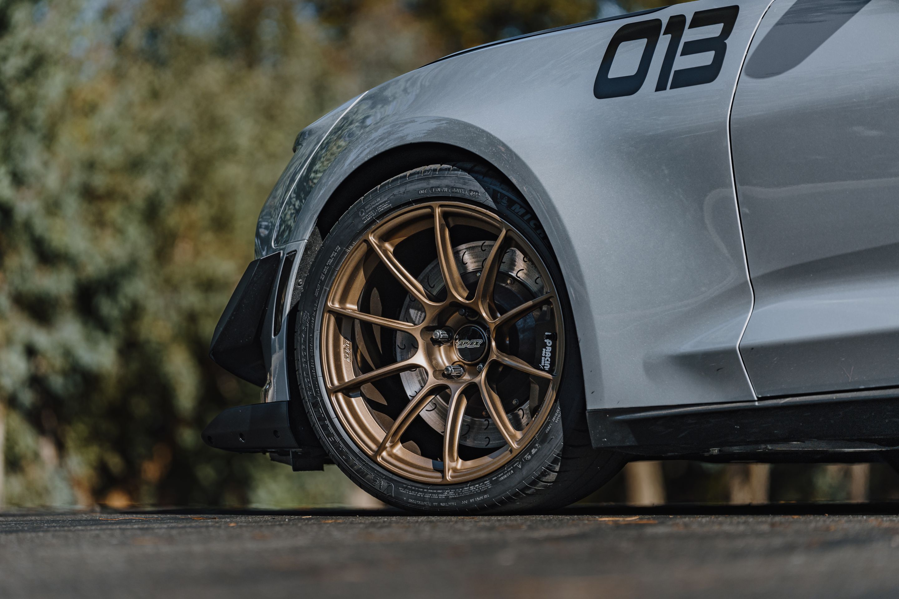 Silver Chevrolet 6th Gen Camaro ZL1 1LE with 19" SM-10RS Apex wheels in Satin Bronze