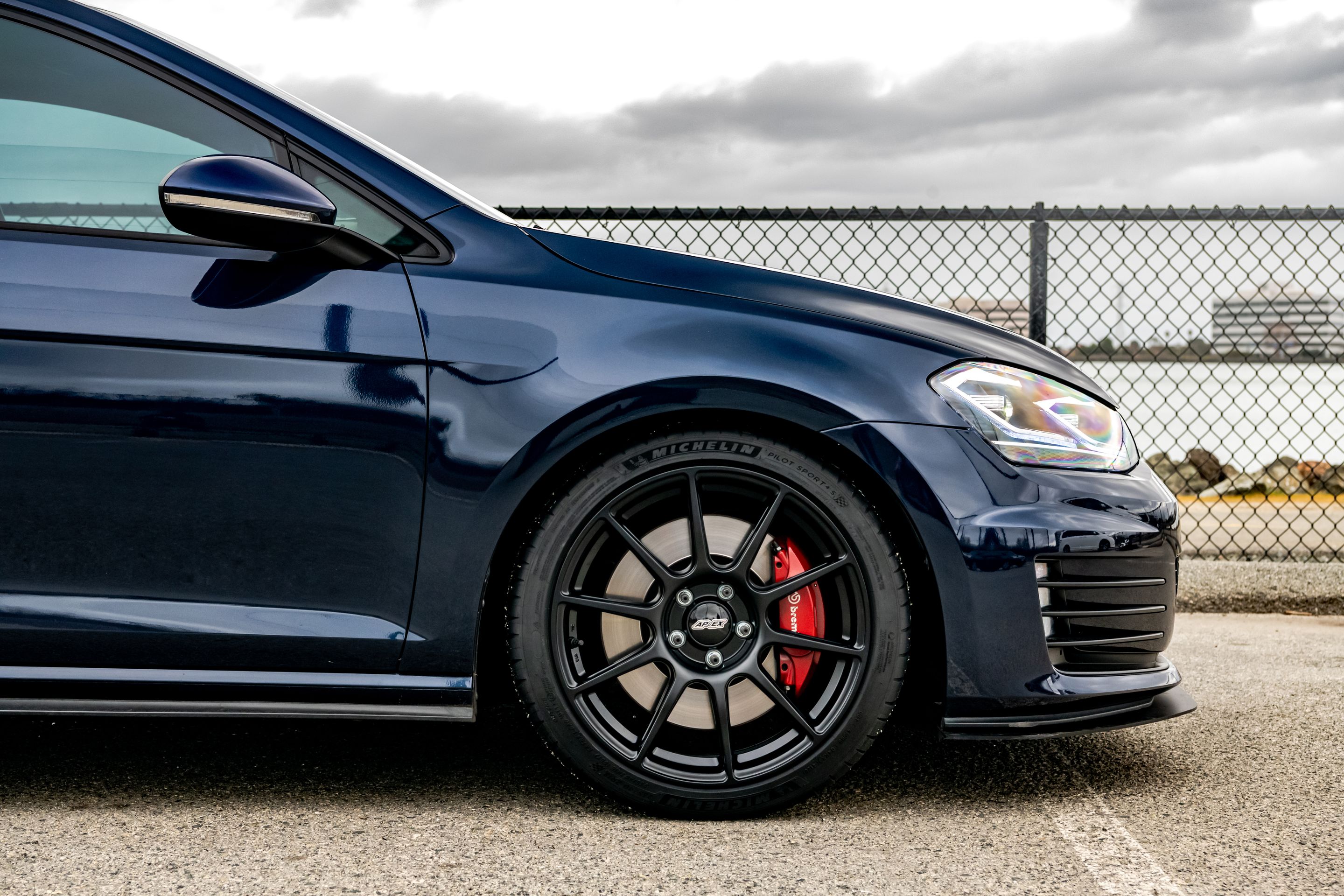 Blue VW MK7 GTI with 18" SM-10 Apex wheels in Satin Black