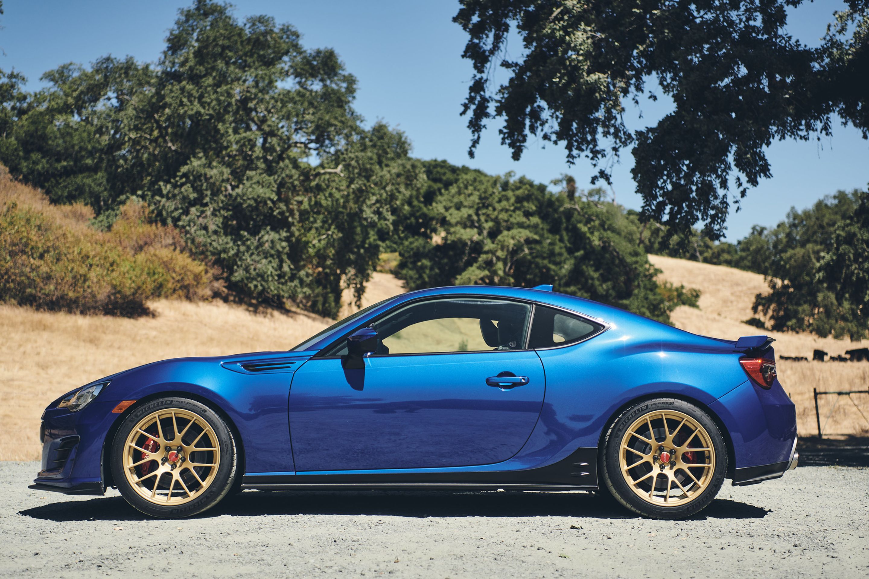 Blue Subaru ZC6 / Gen 1 BRZ with 17" EC-7R Apex wheels in Satin Gold