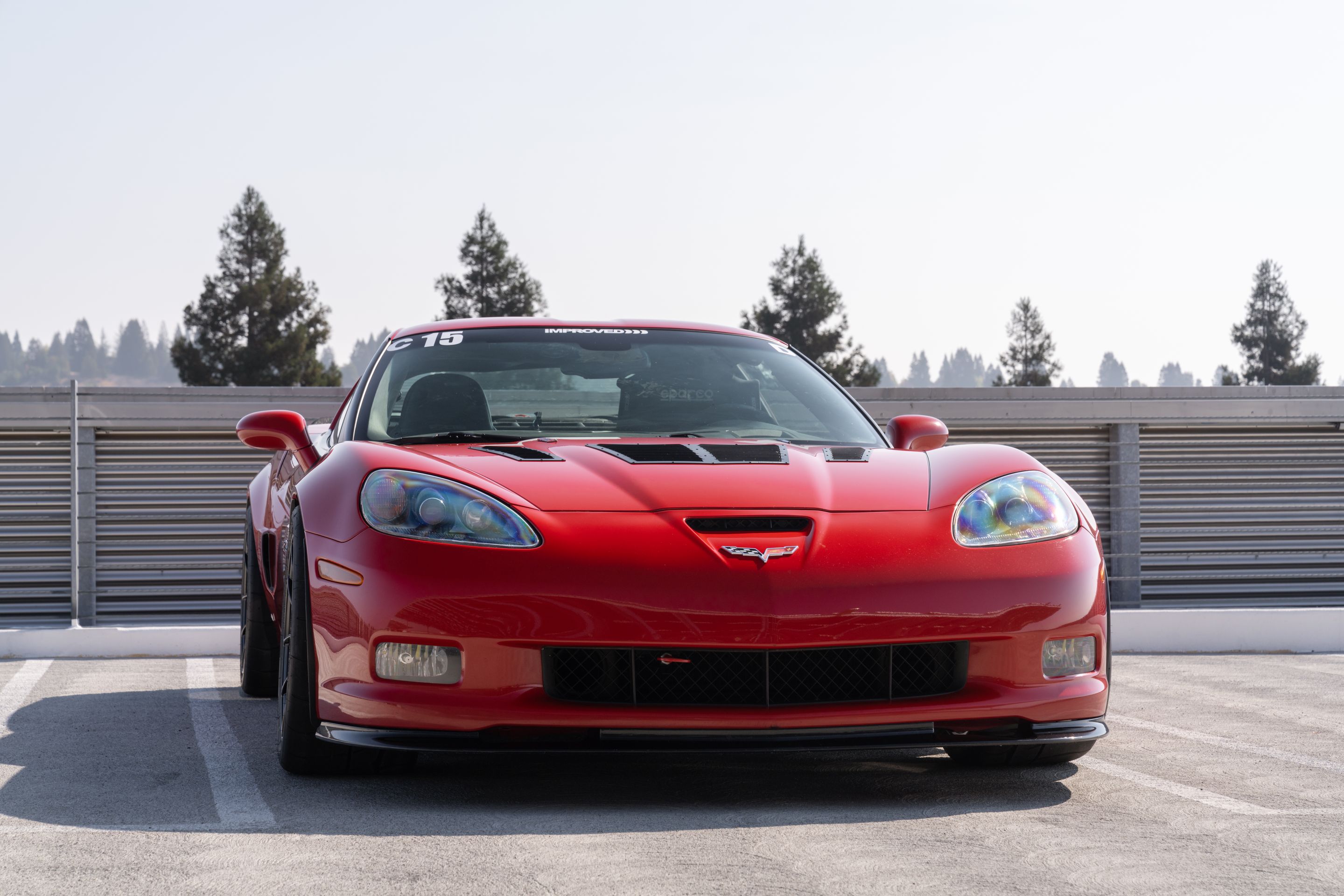 Red Chevrolet C6 Corvette Z06 with 18" VS-5RS Apex wheels in Satin Black