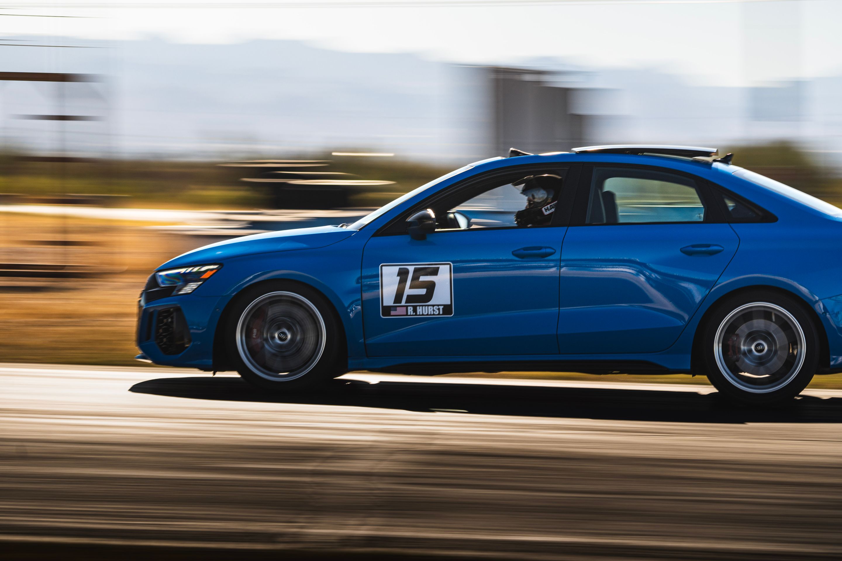 Blue Audi 8Y RS 3 with 18" VS-5RS Apex wheels in Brushed Clear