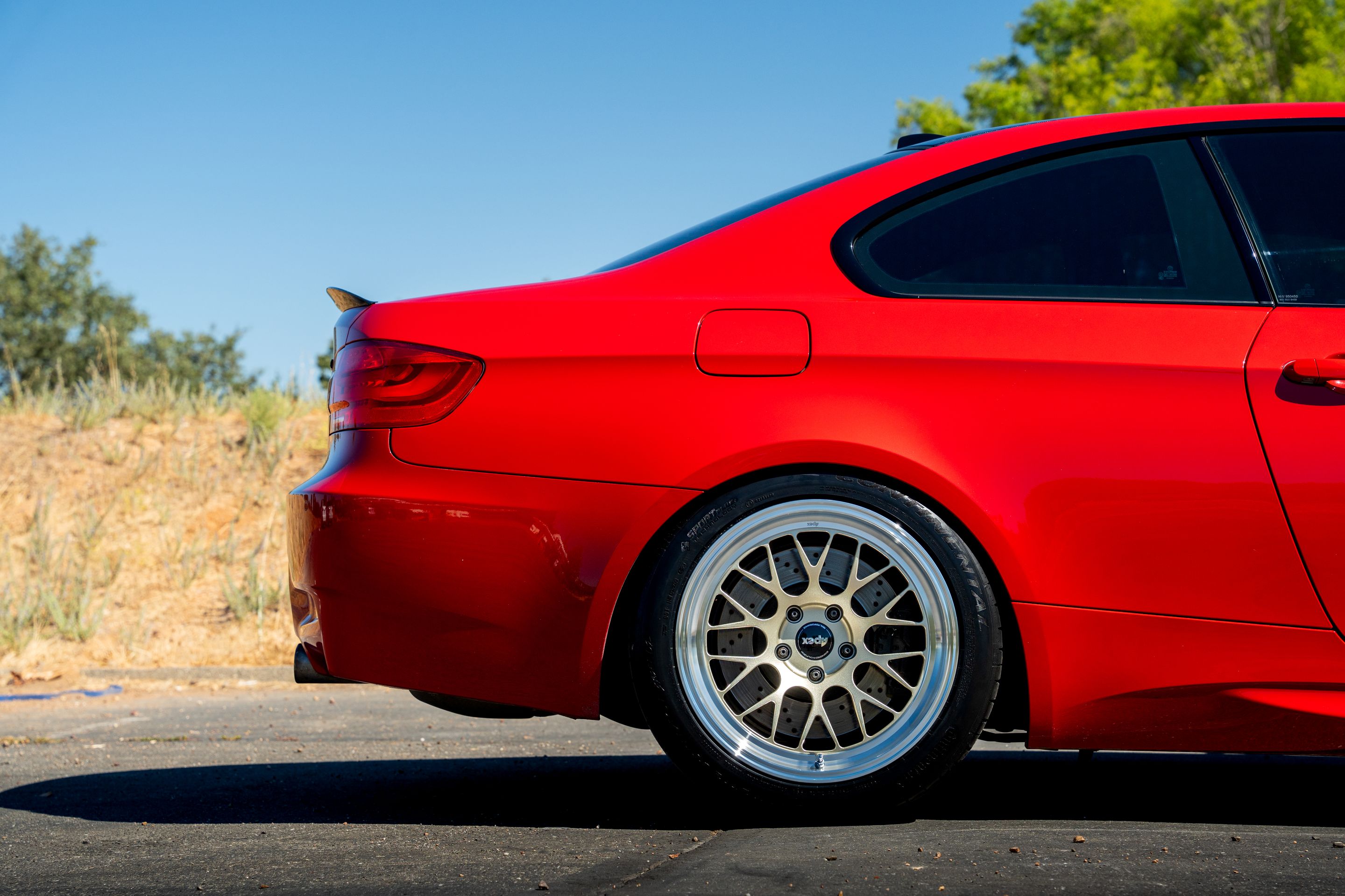 Red BMW E92 Coupe M3 with 18" ML-10RT Apex wheels in Machined Lip Gloss Motorsport Gold