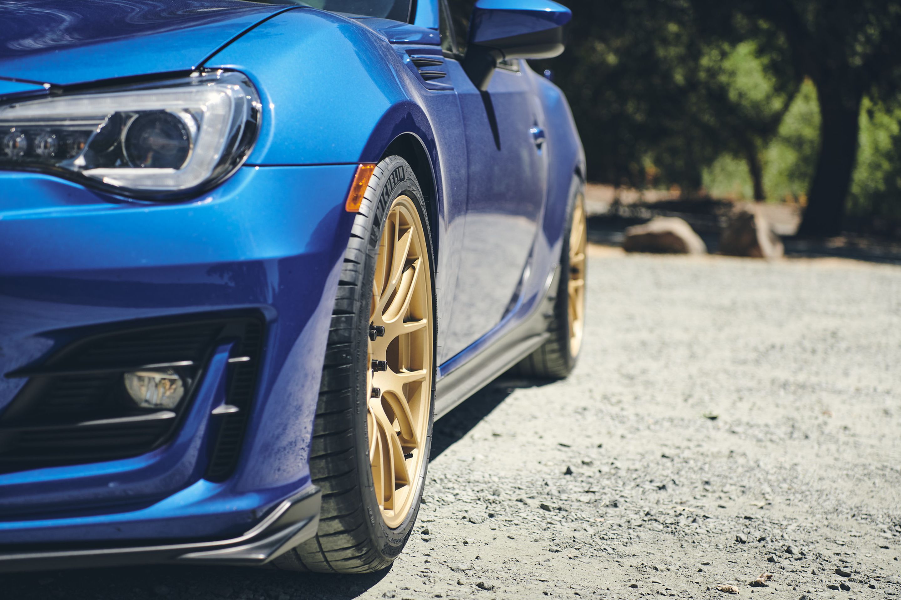Blue Subaru ZC6 / Gen 1 BRZ with 17" EC-7R Apex wheels in Satin Gold