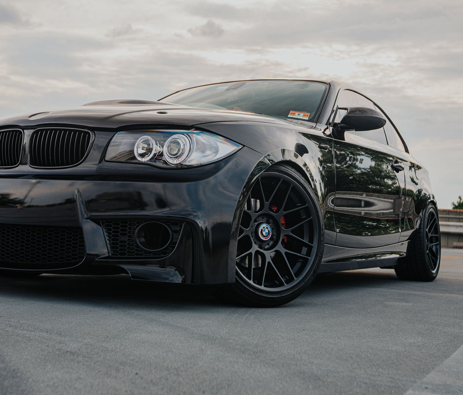 Black BMW E82 1M with 18" ARC-8 Apex wheels in Satin Black