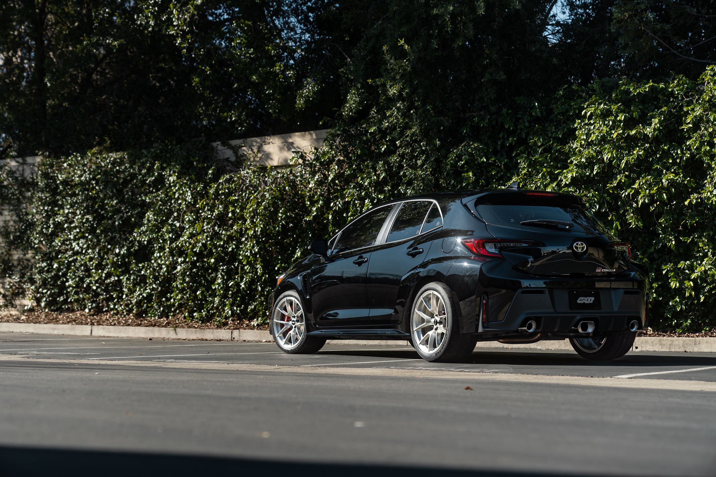 Black Toyota GR Corolla with 18" VS-5RS Apex wheels in Brushed Clear
