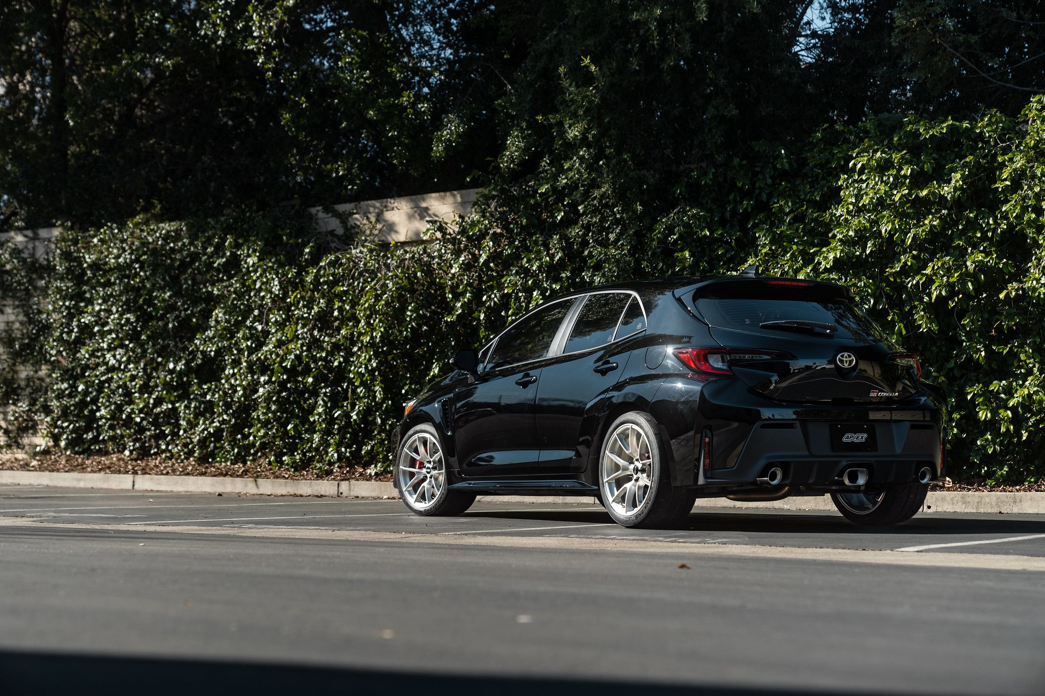 Black Toyota GR Corolla with 18" VS-5RS Apex wheels in Brushed Clear