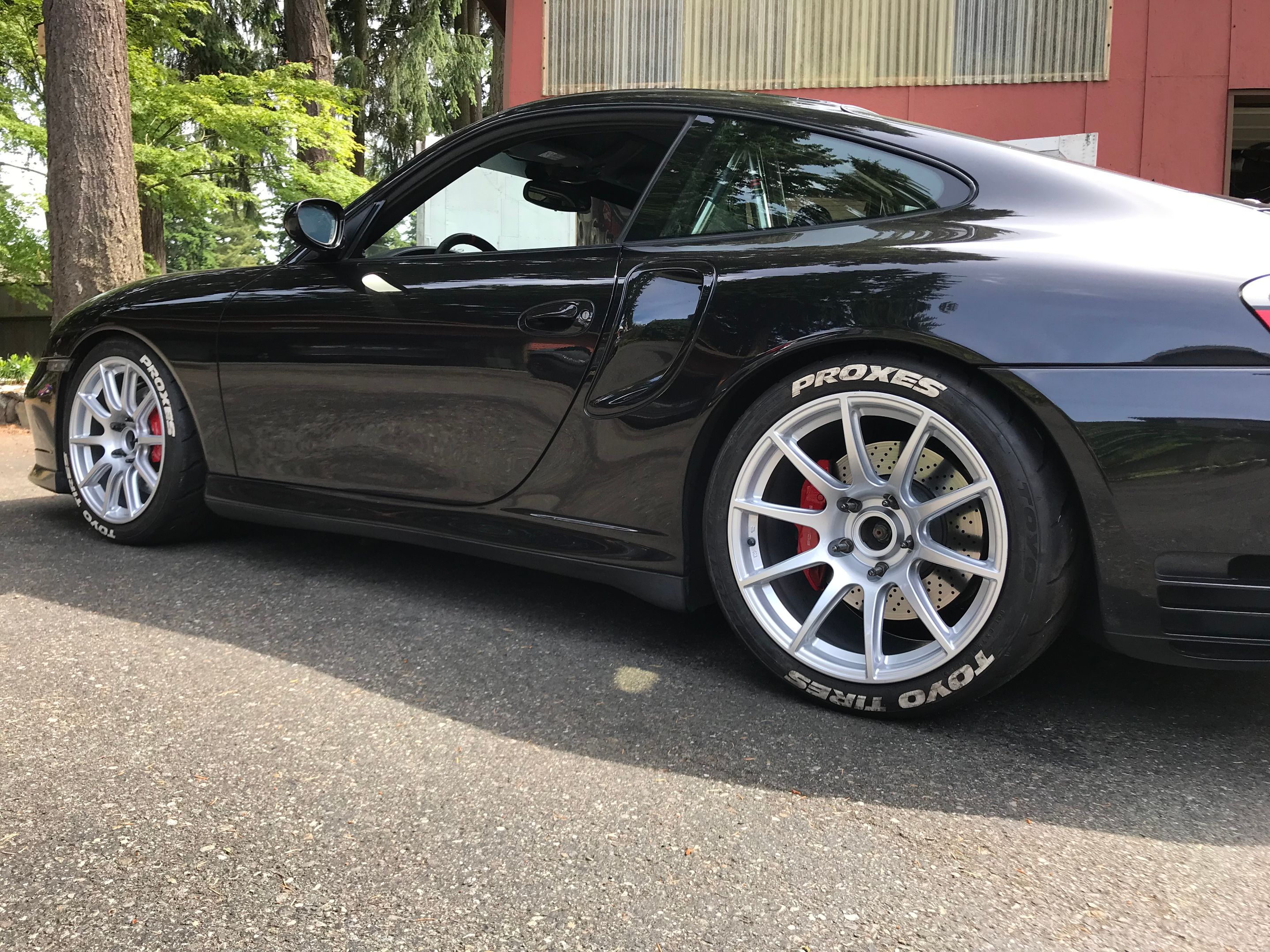 Black Porsche 911 996 Turbo with 18" SM-10 Apex wheels in Race Silver