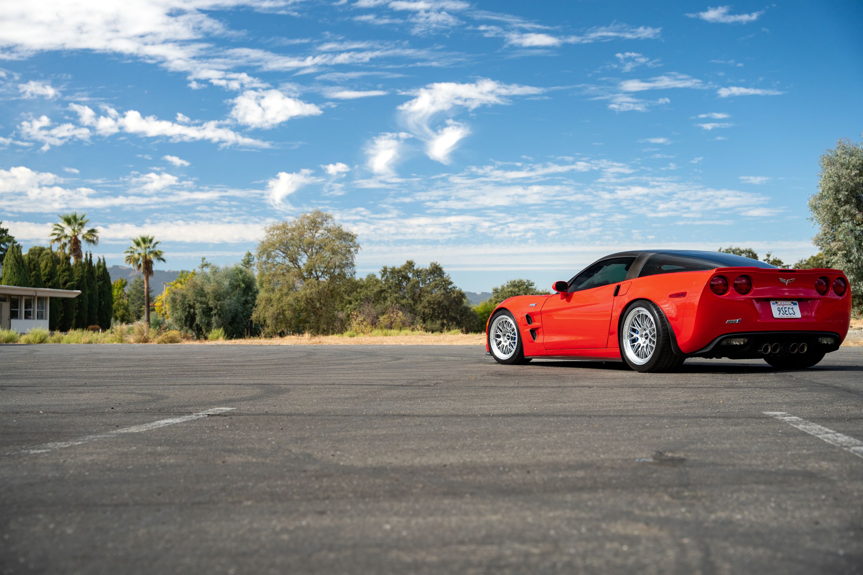 Red Chevrolet C6 Corvette ZR-1 with 18"/19" ML-10RT Apex wheels in Machined Lip Race Silver
