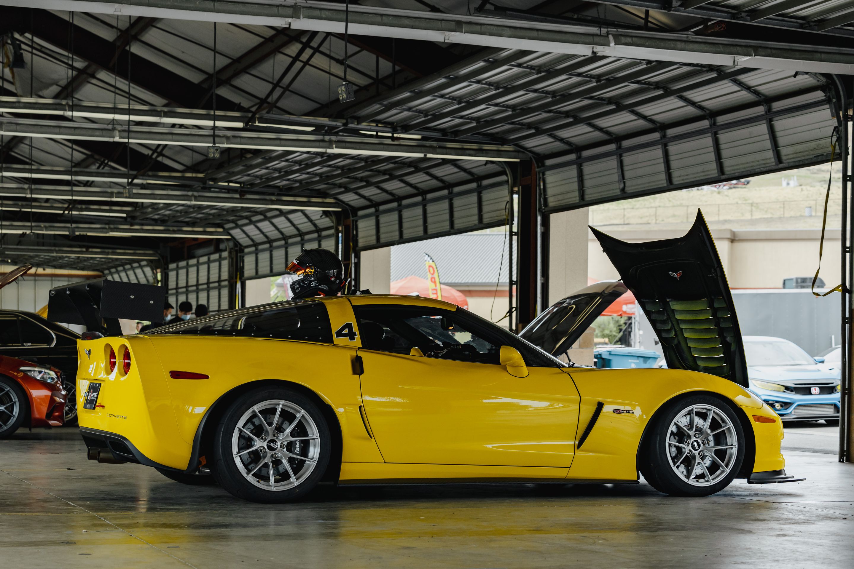 Yellow Chevrolet C6 Corvette Z06 with 18" VS-5RS Apex wheels in Brushed Clear