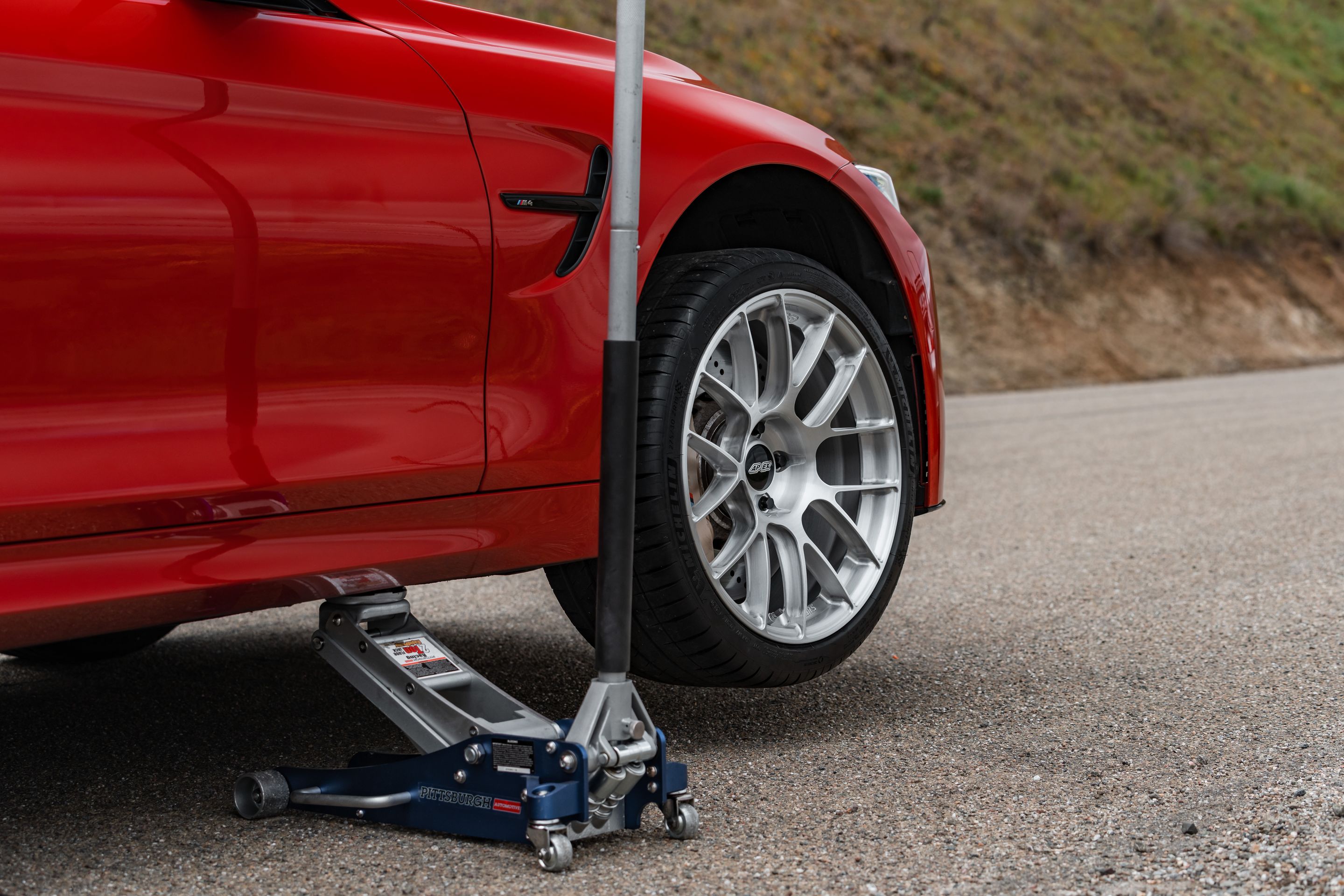 Red BMW F82 Coupe M4 with 19" EC-7RS Apex wheels in Brushed Clear