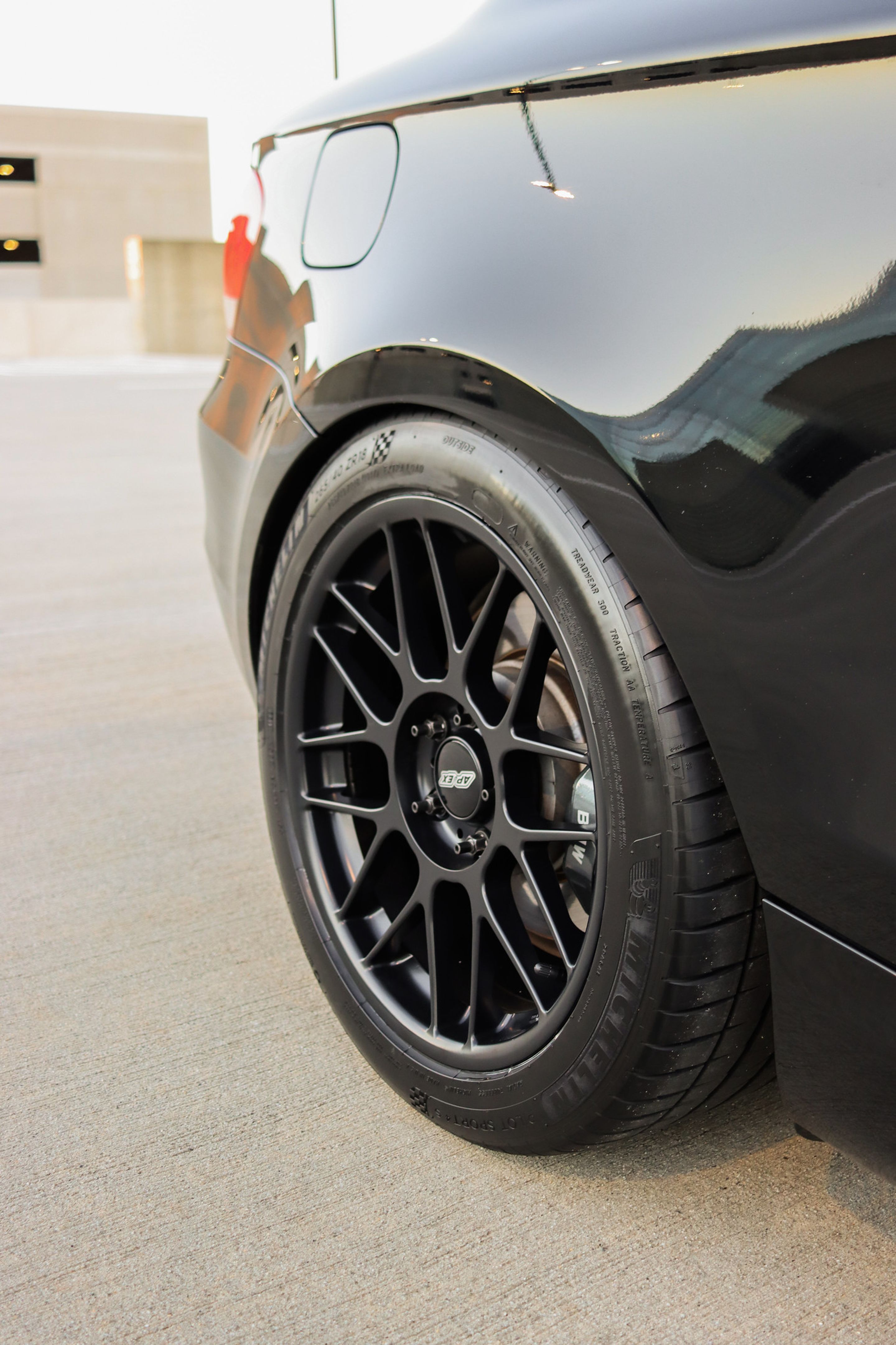 Black BMW E82 Coupe 1 Series with 18" ARC-8 Apex wheels in Satin Black