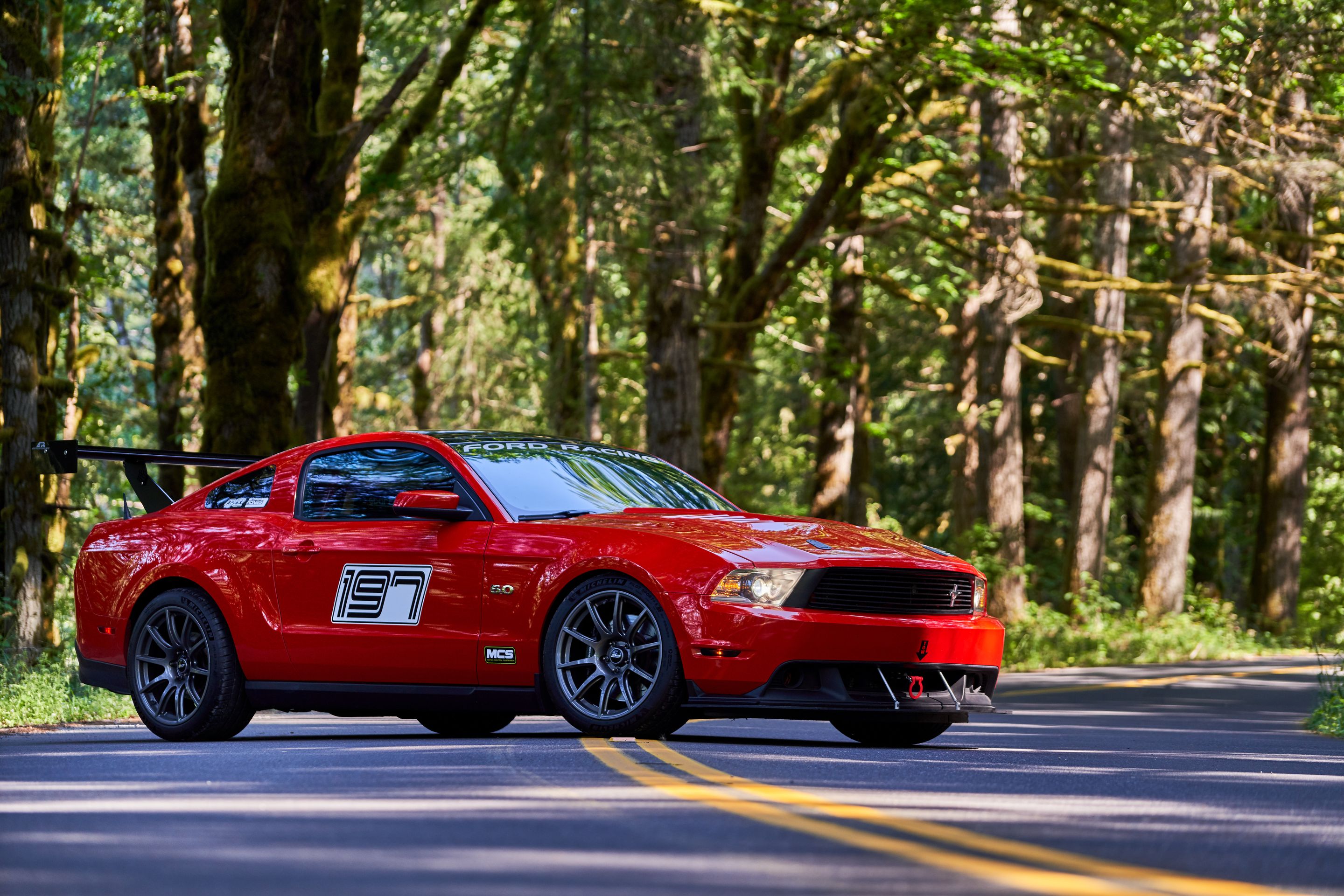 Red Ford S197 Mustang GT with 19" SM-10 Apex wheels in Anthracite