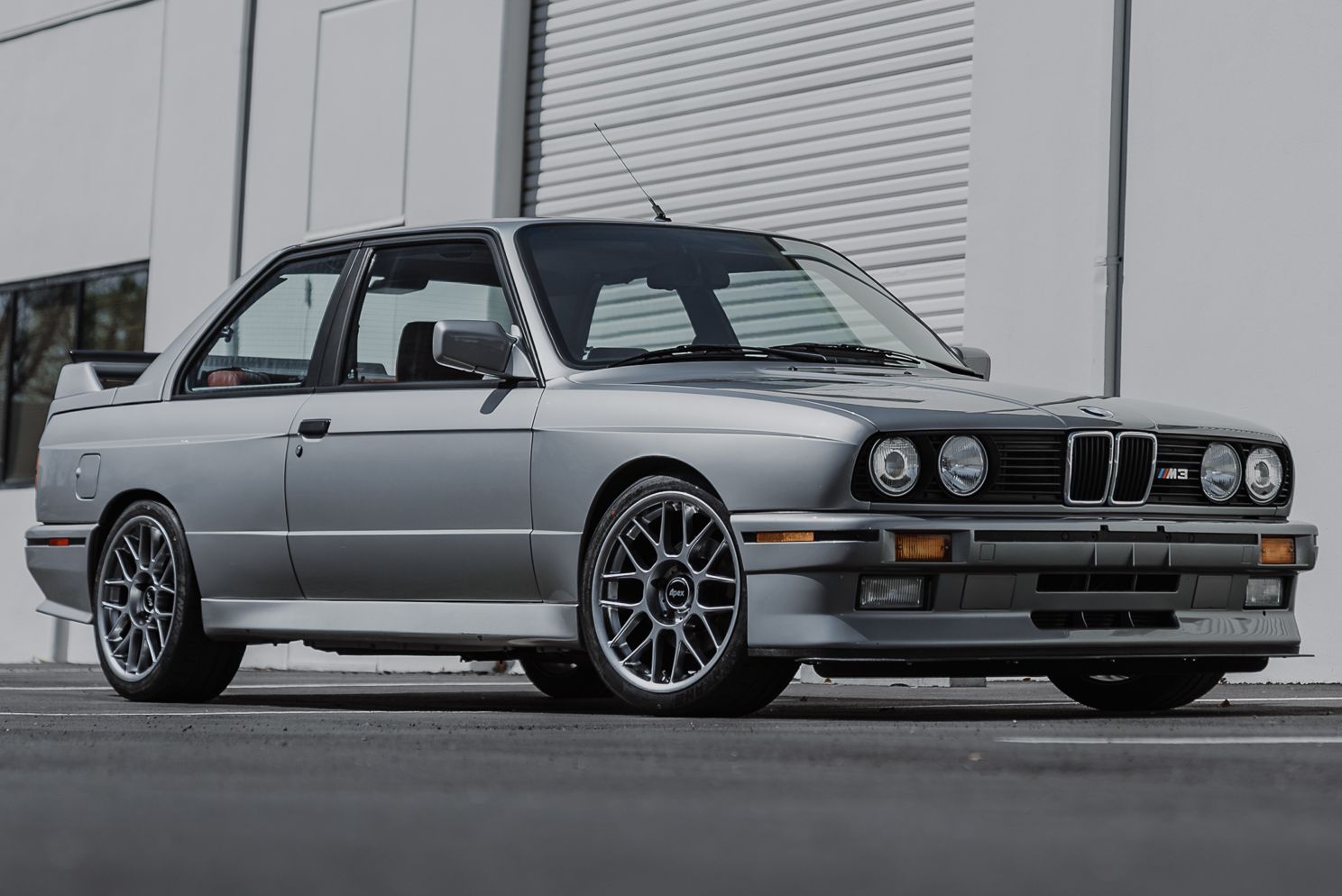 Silver BMW E30 M3 with 17" ARC-8 Apex wheels in Hyper Black