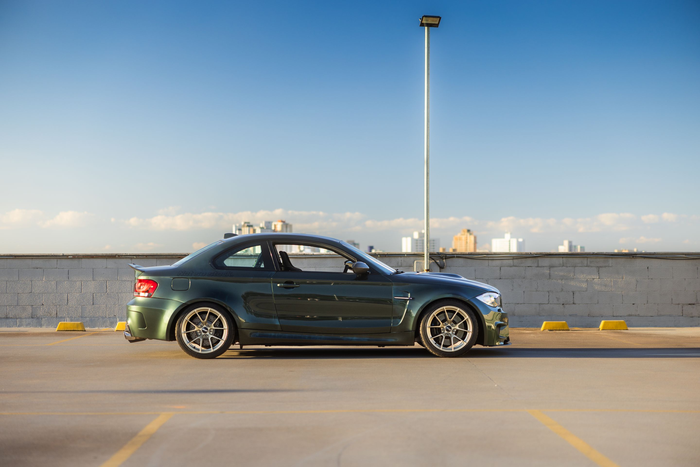 Green BMW E82 1M with 18" VS-5RS Apex wheels in Motorsport Gold