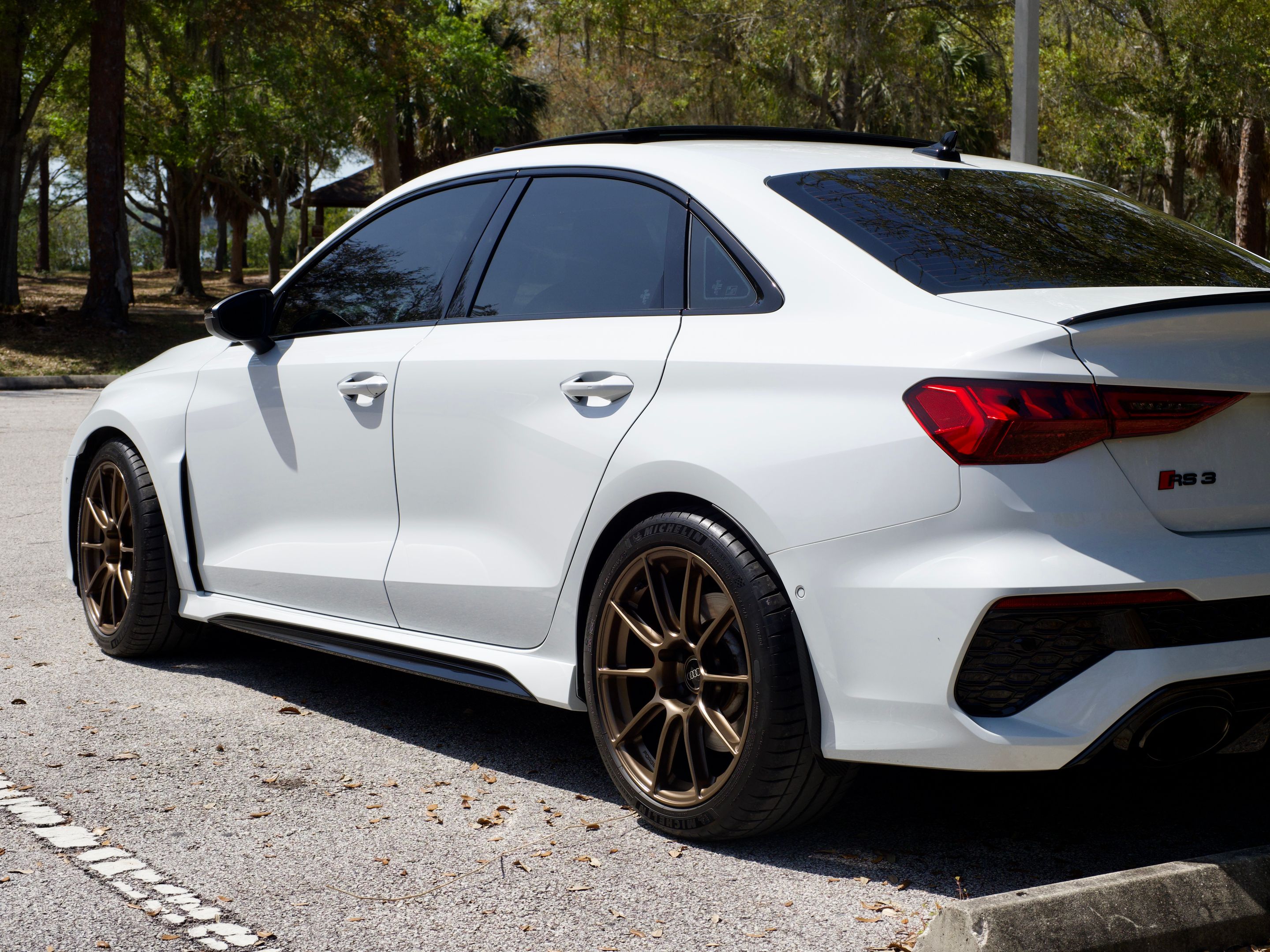 White Audi 8Y RS 3 with 18" SM-10RS Apex wheels in Satin Bronze