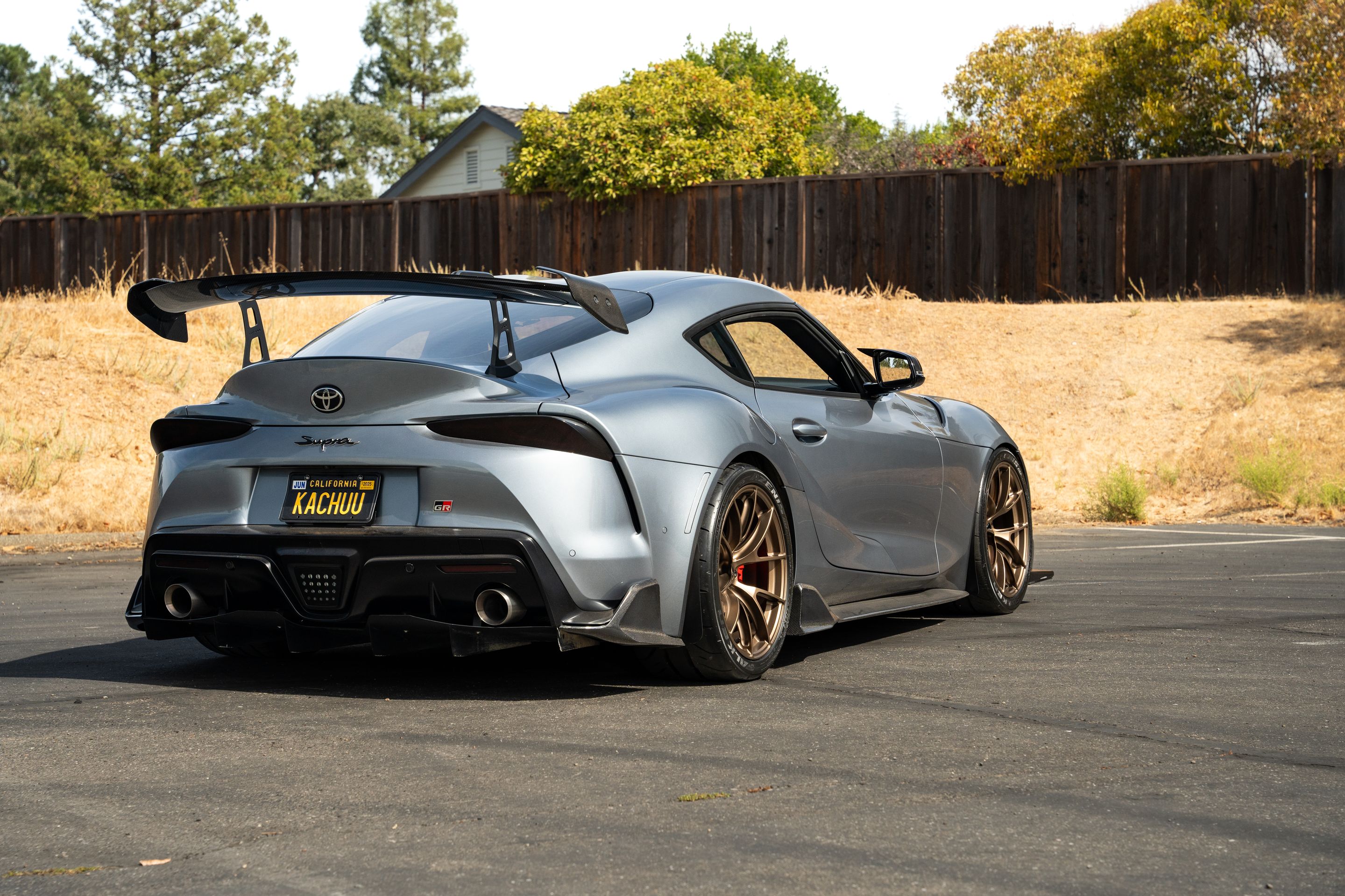 Grey Toyota GR Supra with 19" VS-5RS Apex wheels in Satin Bronze