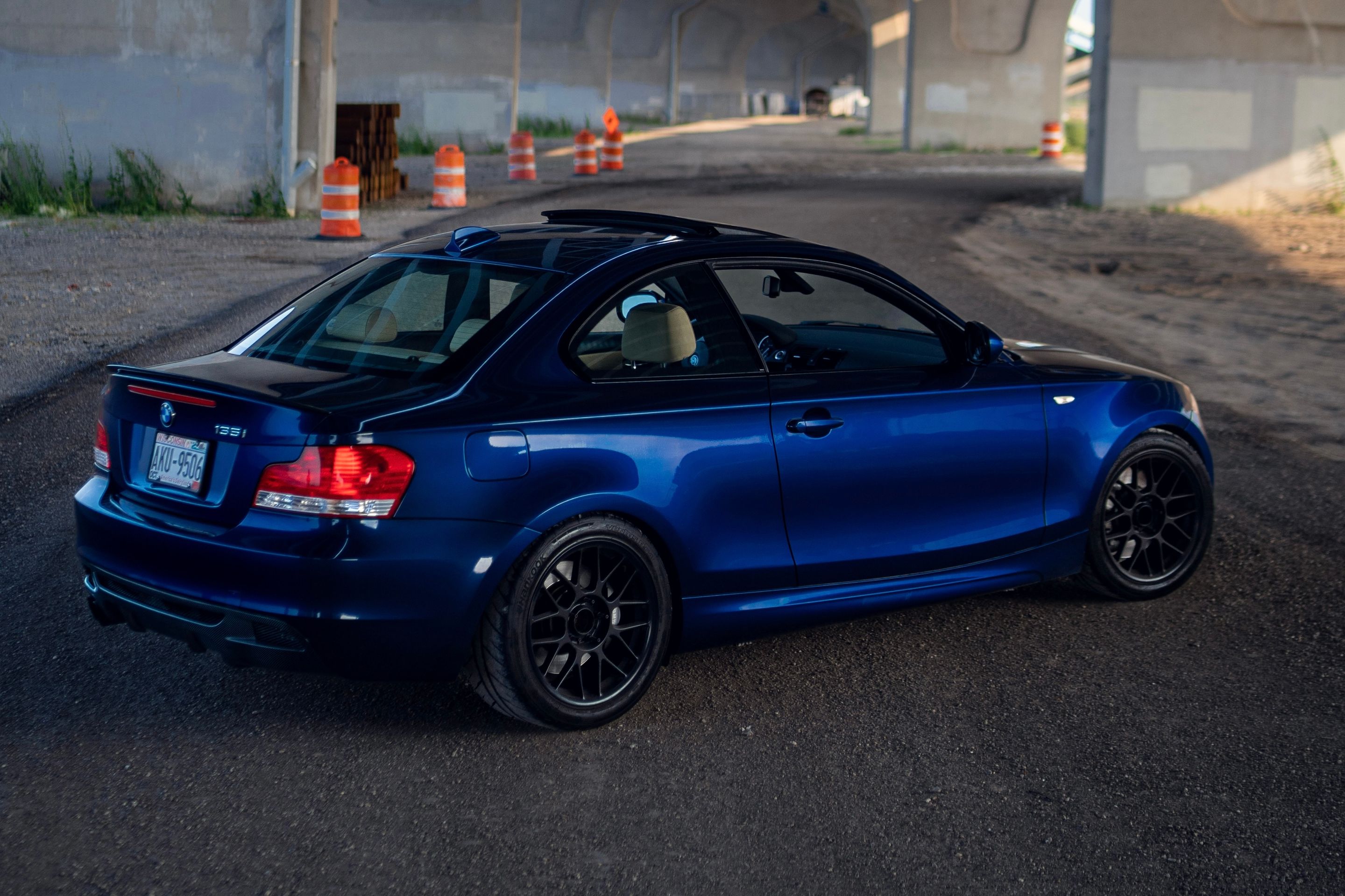 Blue BMW E82 Coupe 1 Series with 17" ARC-8 Apex wheels in Satin Black