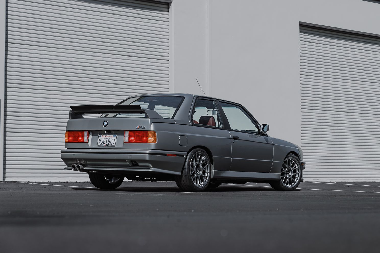 Silver BMW E30 M3 with 17" ARC-8 Apex wheels in Hyper Black