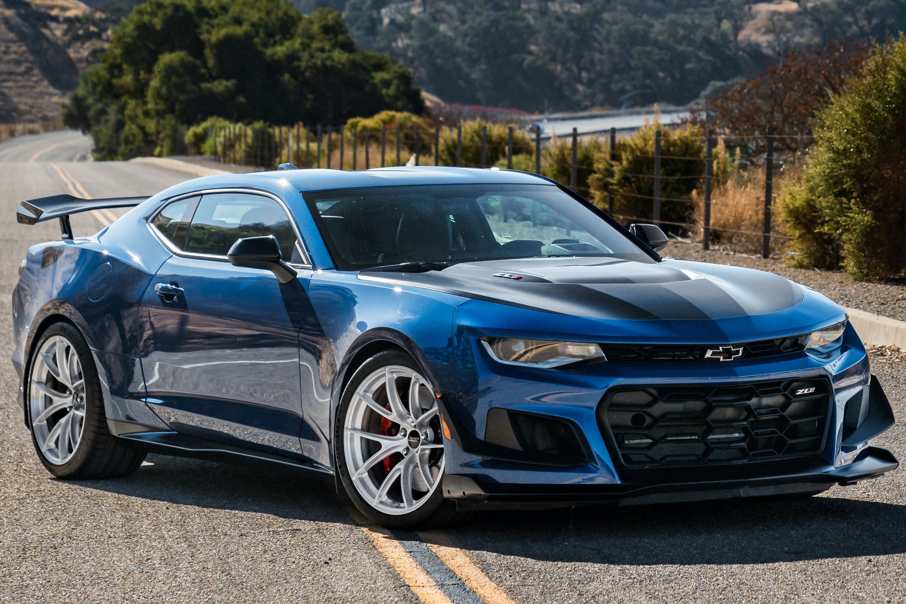 Blue Chevrolet 6th Gen Camaro ZL1 1LE with 20" VS-5RS Apex wheels in Brushed Clear