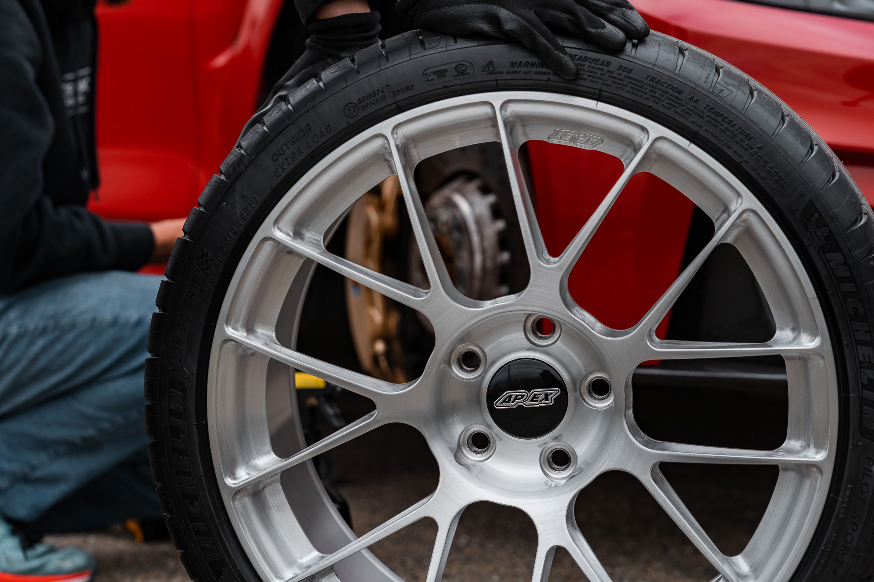 Red BMW F82 Coupe M4 with 19" EC-7RS Apex wheels in Brushed Clear