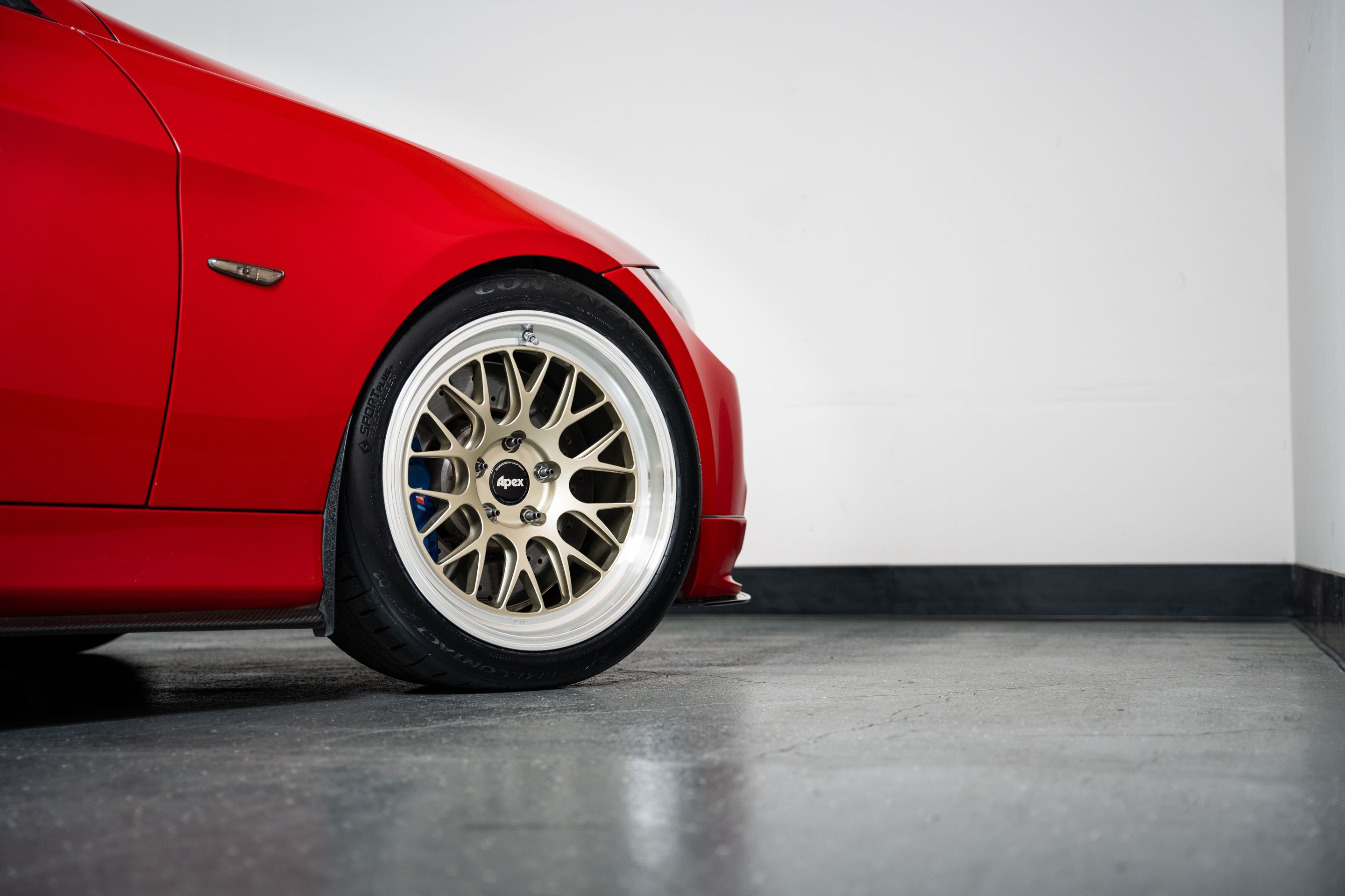 Red BMW E90 Sedan 3 Series with 18" ML-10RT Apex wheels in Machined Lip Gloss Motorsport Gold