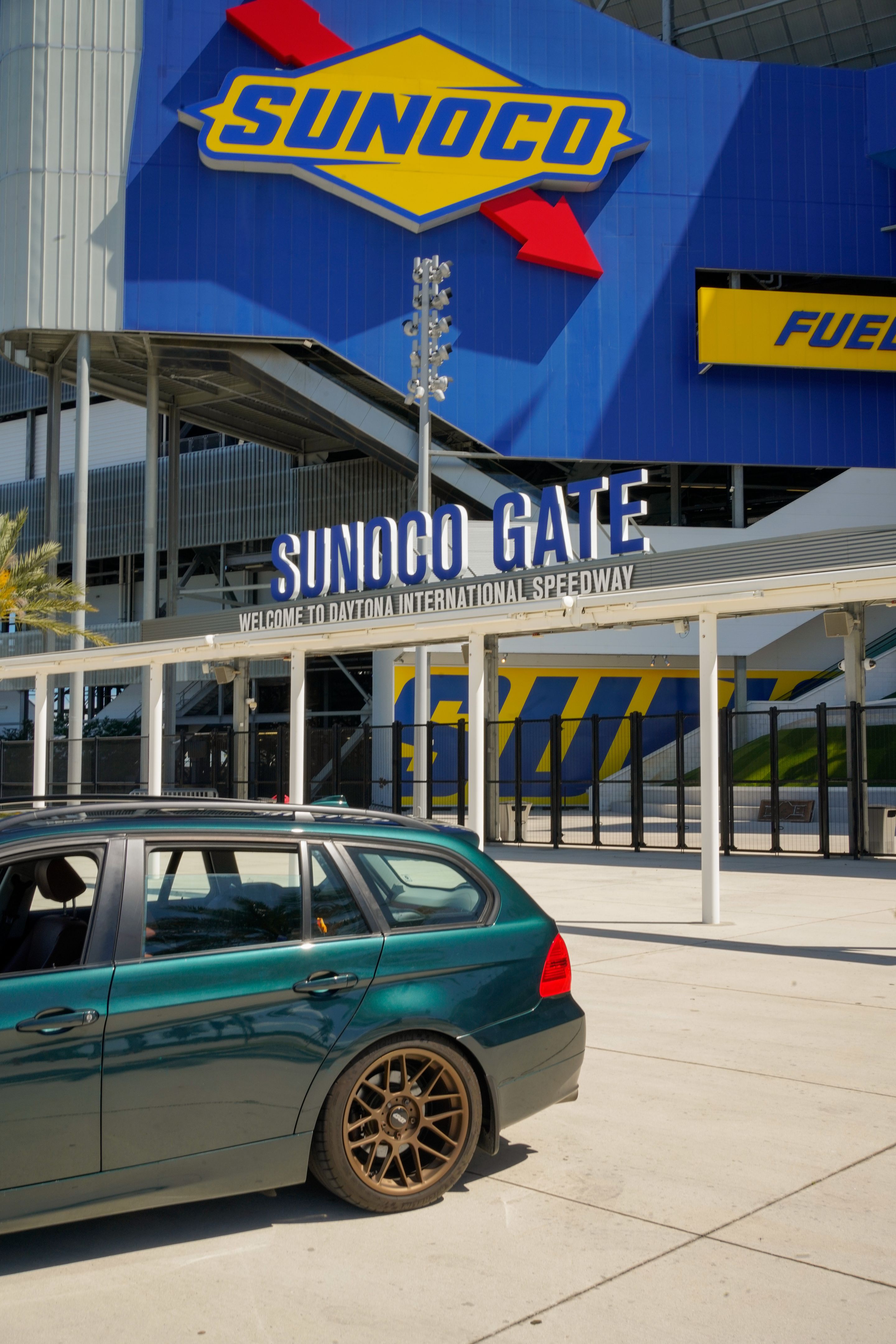 Green BMW E91 Wagon 3 Series with 18" ARC-8 Apex wheels in Satin Bronze
