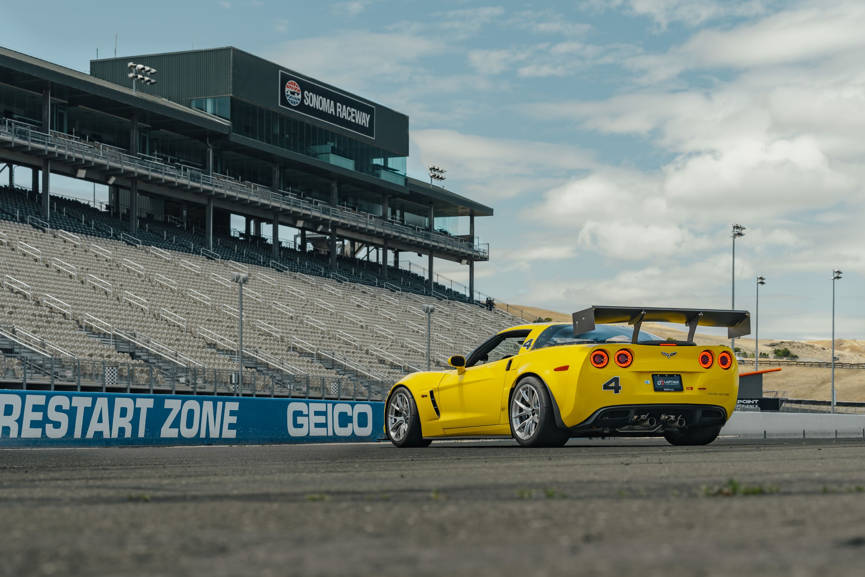 Yellow Chevrolet C6 Corvette Z06 with 18" VS-5RS Apex wheels in Brushed Clear