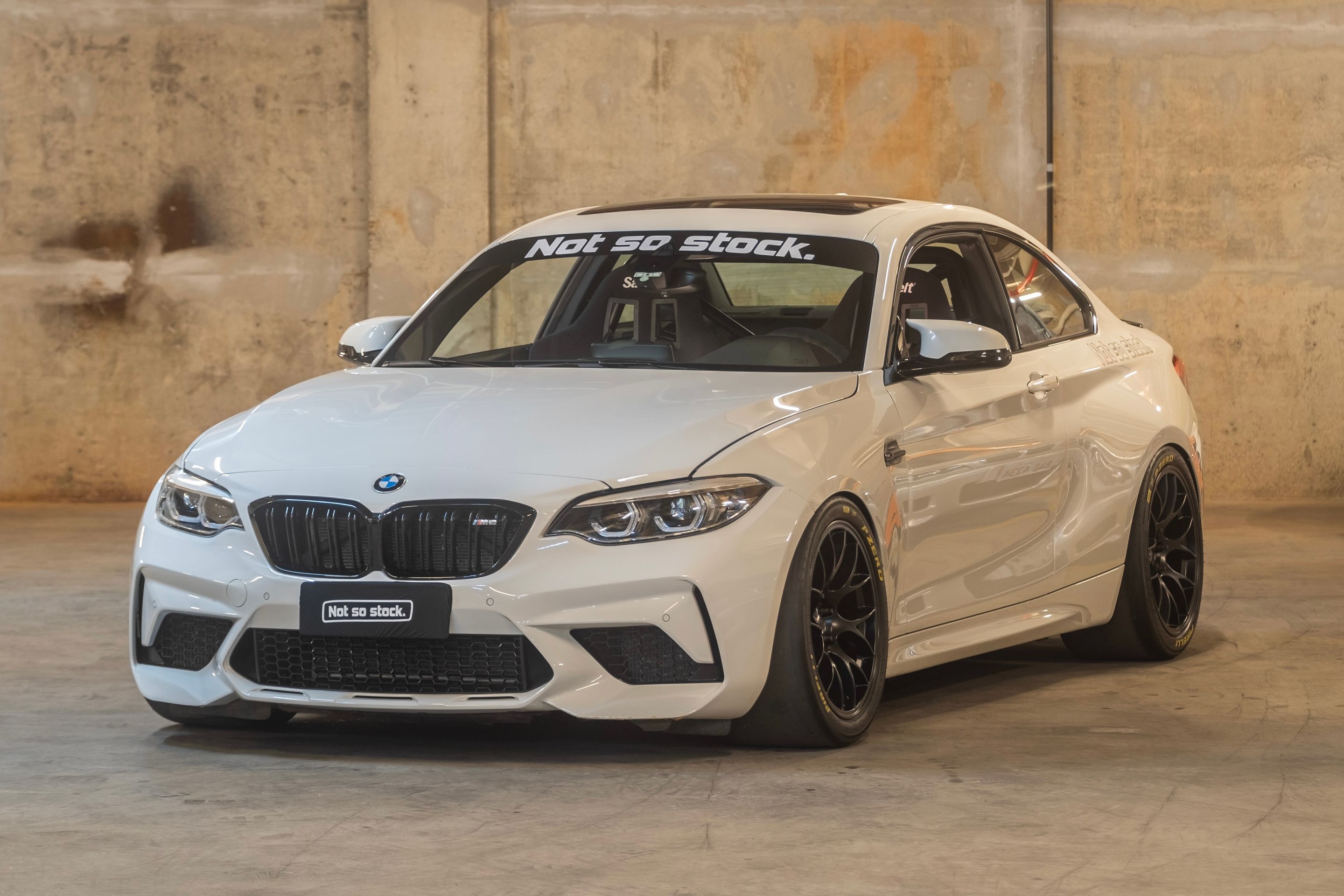 White BMW F87 M2 with 18" EC-7 Apex wheels in Satin Black