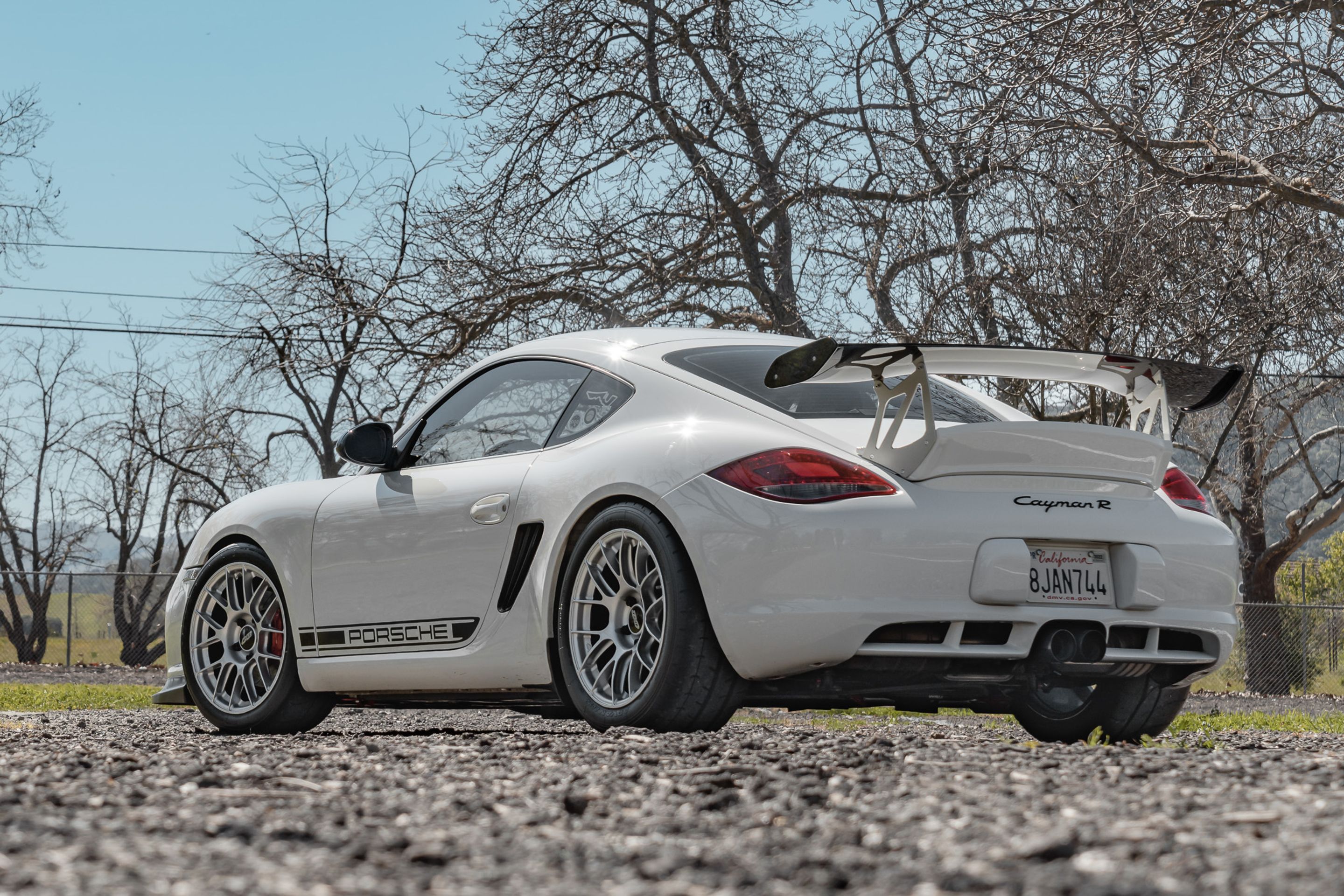 White Porsche 987 Cayman R with 18" EC-7RS Apex wheels in Race Silver