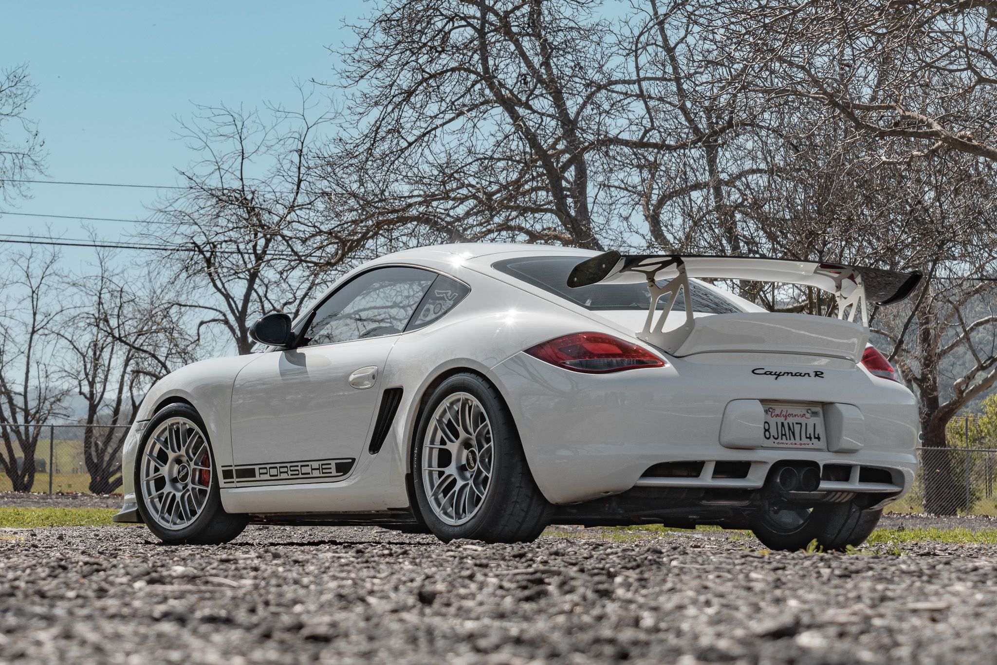 White Porsche 987 Cayman R with 18" EC-7RS Apex wheels in Race Silver