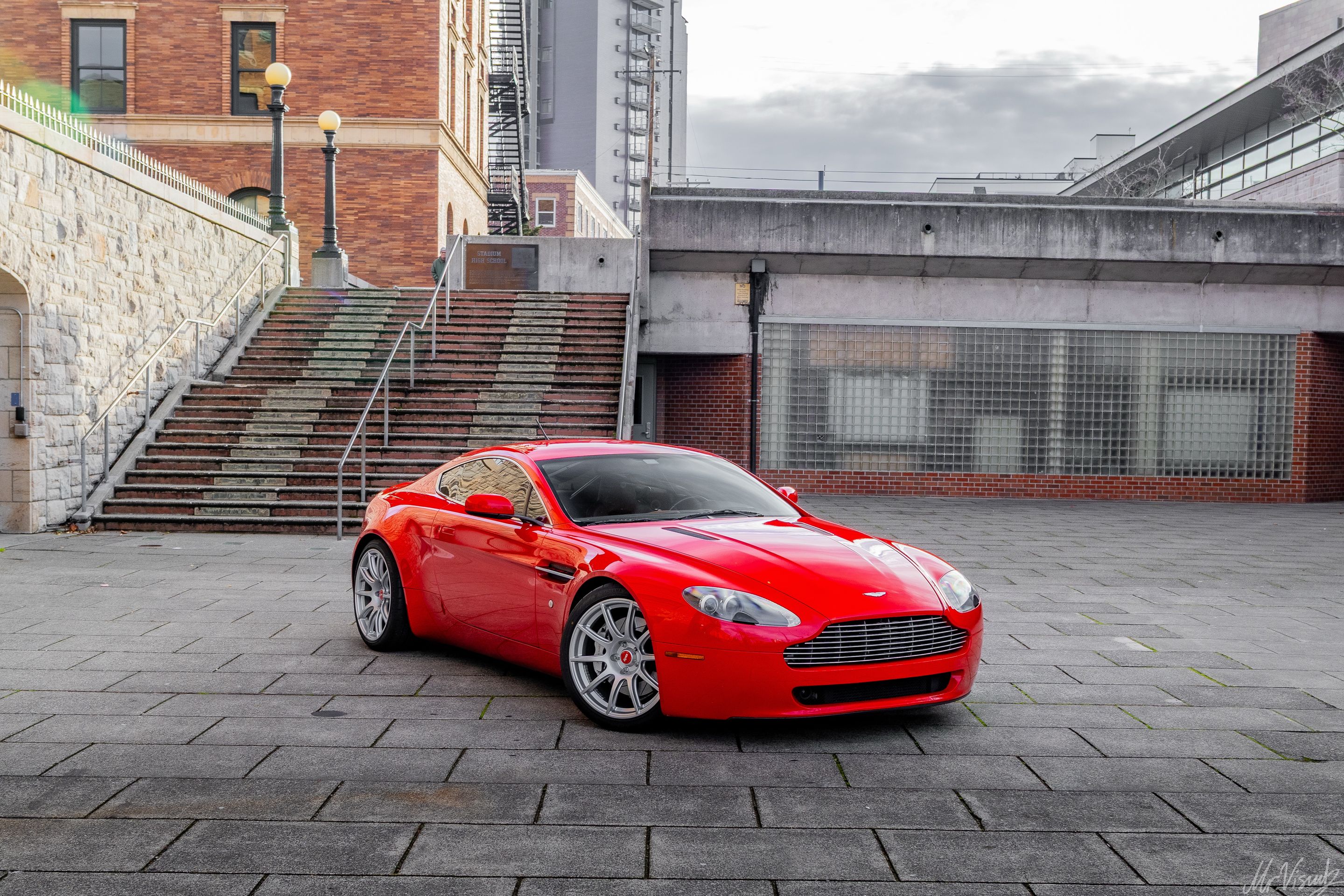 Red Aston Martin V8/V12 Vantage with 19" SM-10 Apex wheels in Race Silver