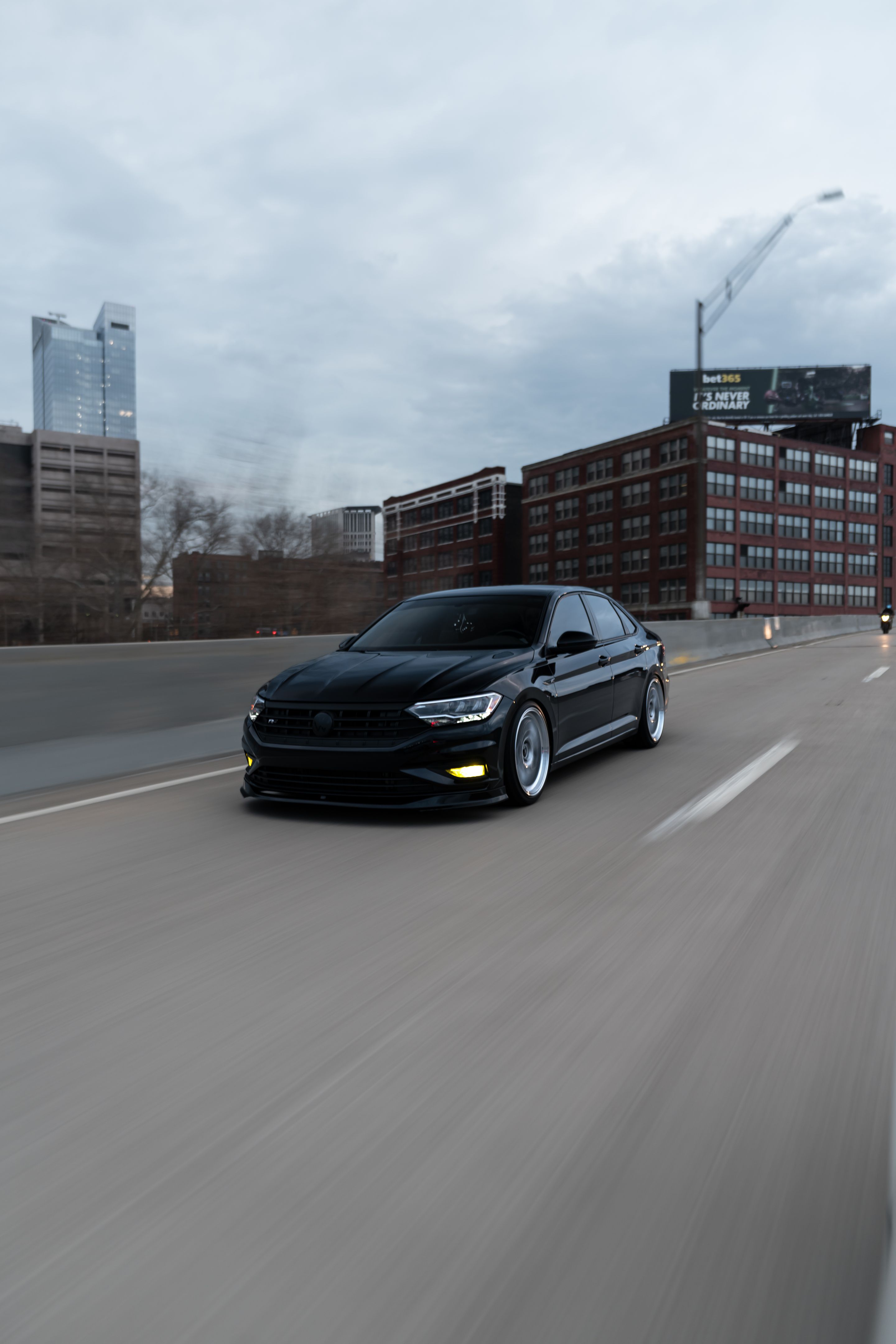 Black VW MK7 Jetta with 19" ML-10RT Apex wheels in Machined Lip Race Silver