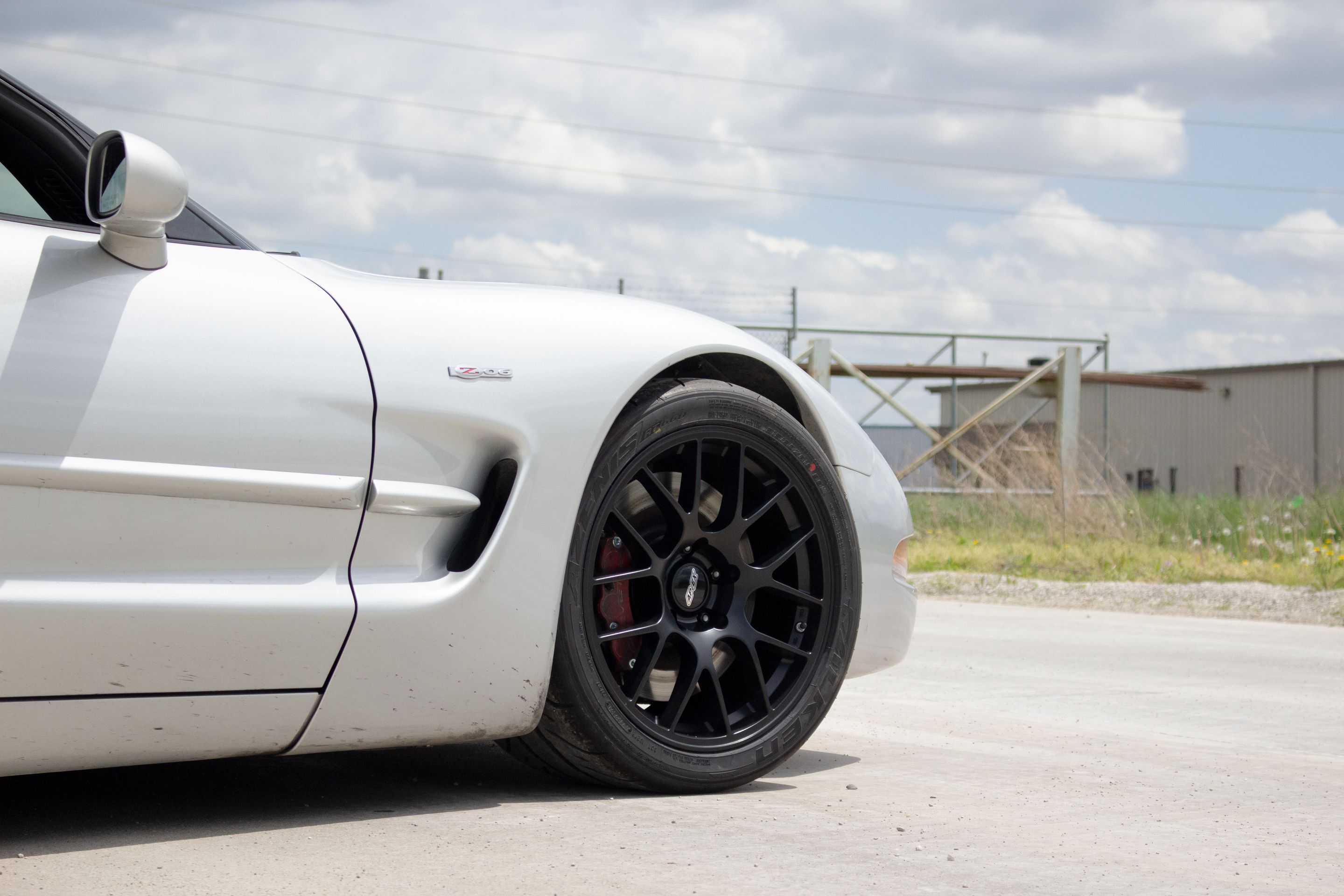Silver Chevrolet C5 Corvette Z06 with 18" EC-7 Apex wheels in Satin Black