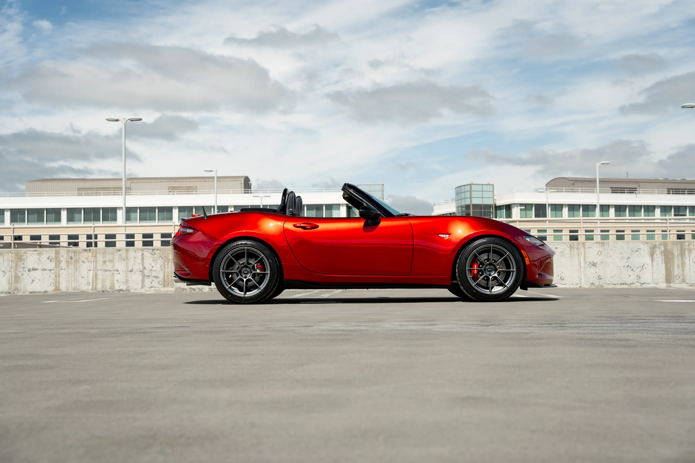 Red Mazda ND MX-5 Miata with 17" SM-8RS Apex wheels in Anthracite