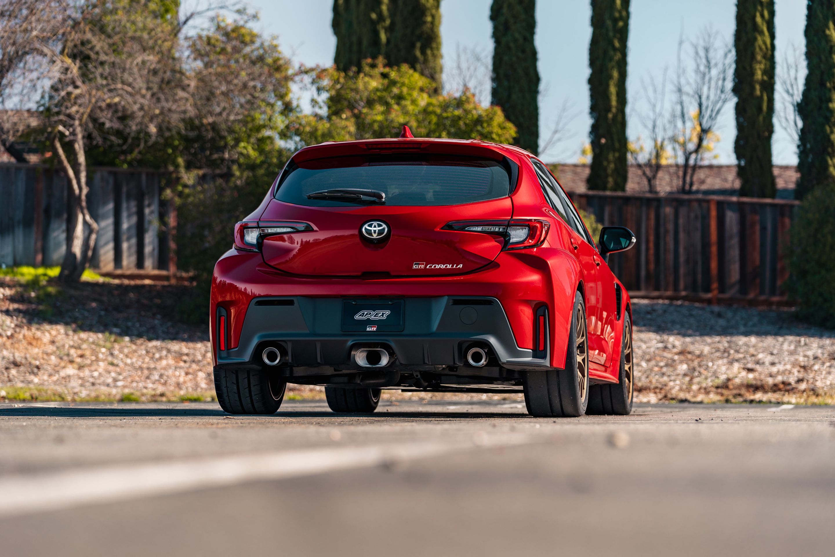 Red Toyota GR Corolla with 18" EC-7 Apex wheels in Satin Bronze