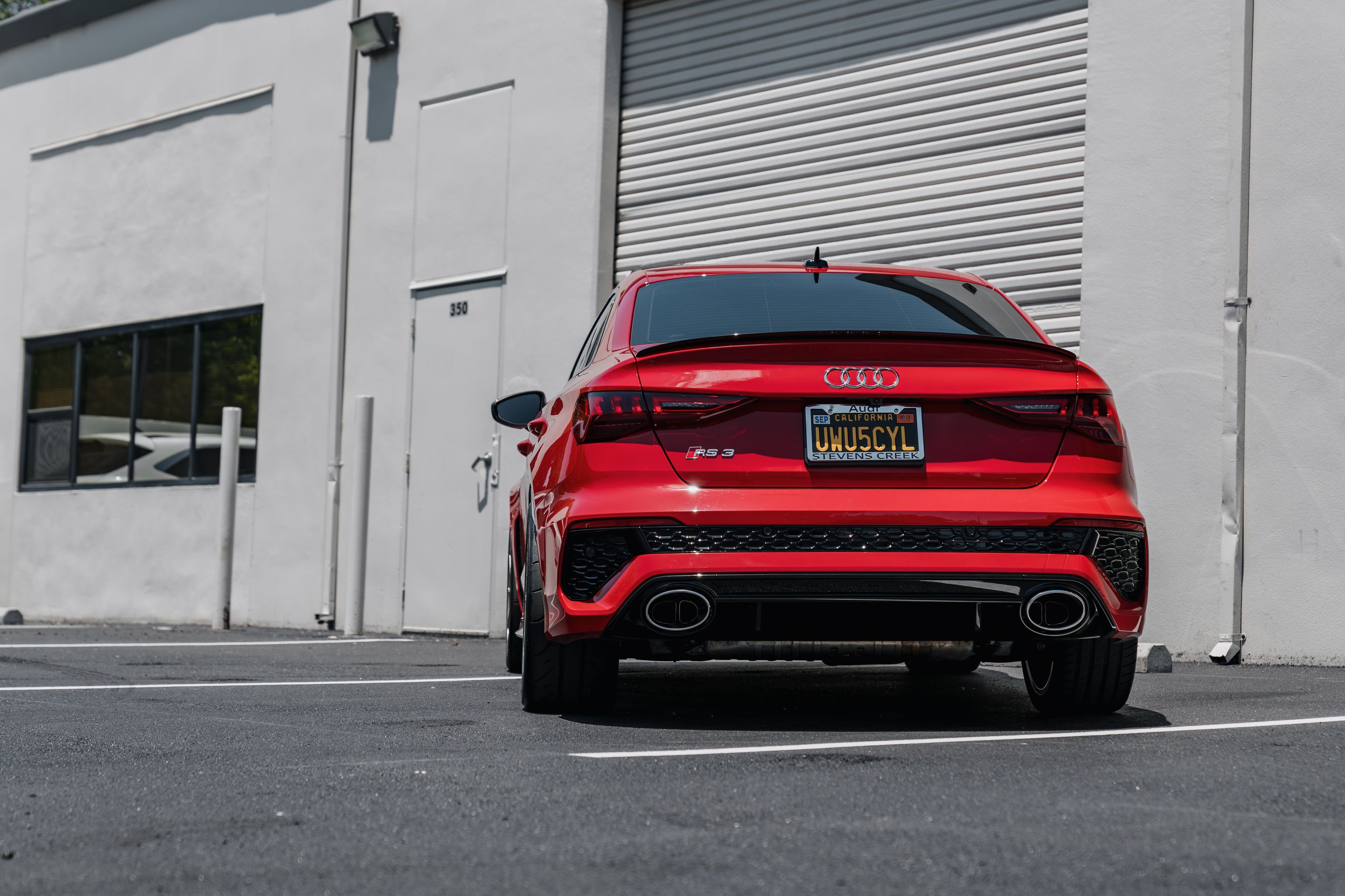 Red Audi 8Y RS 3 with 18" SM-10RS Apex wheels in Motorsport Gold